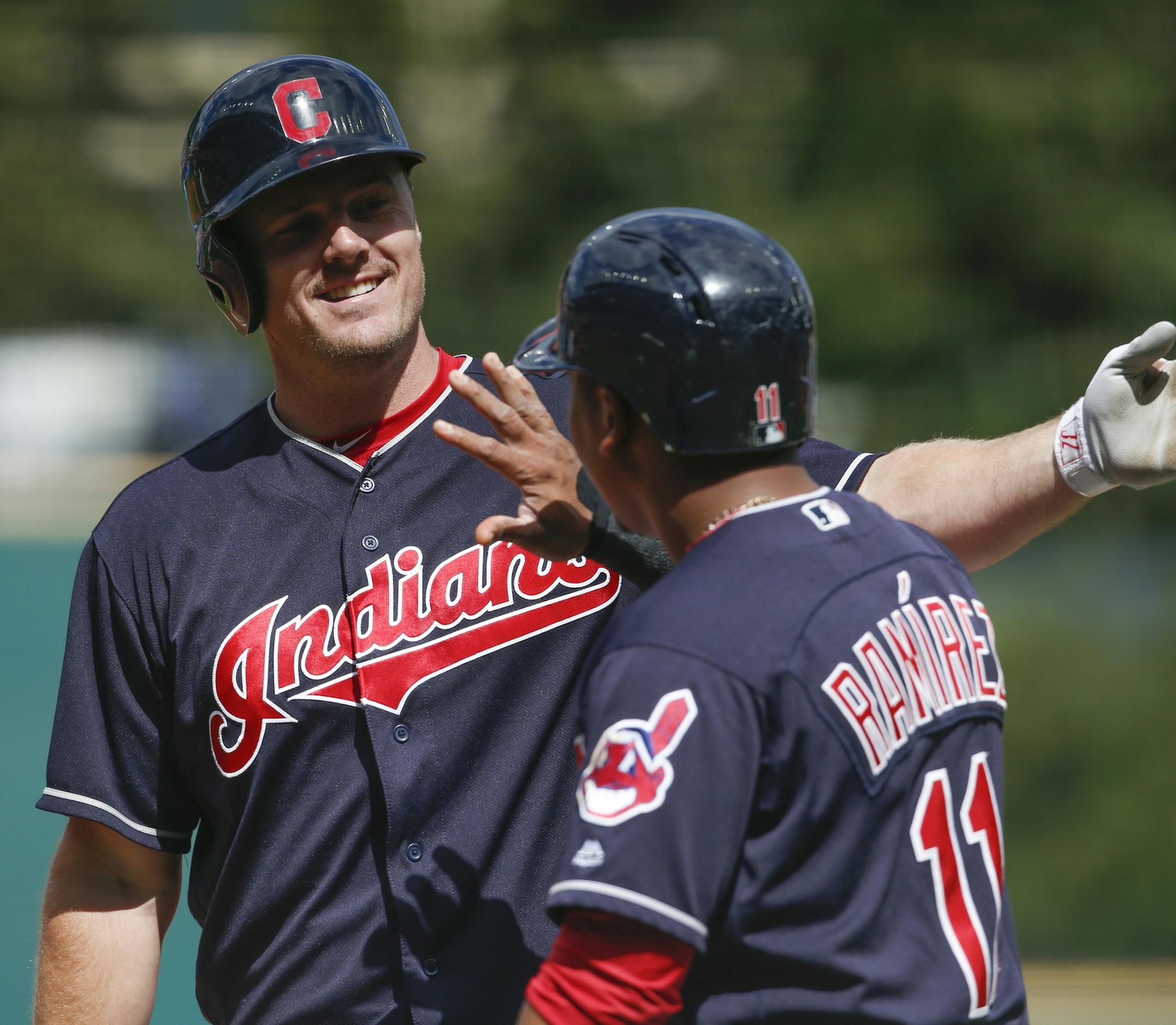 Cleveland Indians' Jay Bruce celebrates with Jose Ramirez (11) after hitting a three-run home run off Detroit Tigers starting pitcher Buck Farmer during the first inning in a baseball game, Wednesday, Sept. 13, 2017, in Cleveland. (AP Photo/Ron Schwane)