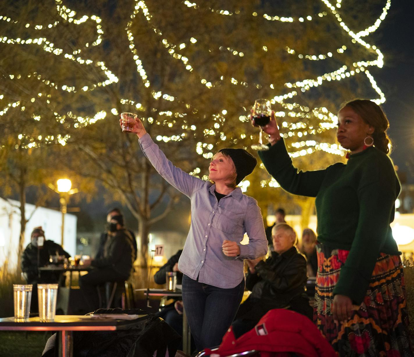 Naomi Dornfeld and Nandi Magadla toasted remarks by opening act Diane Miller at Icehouse on Monday night.