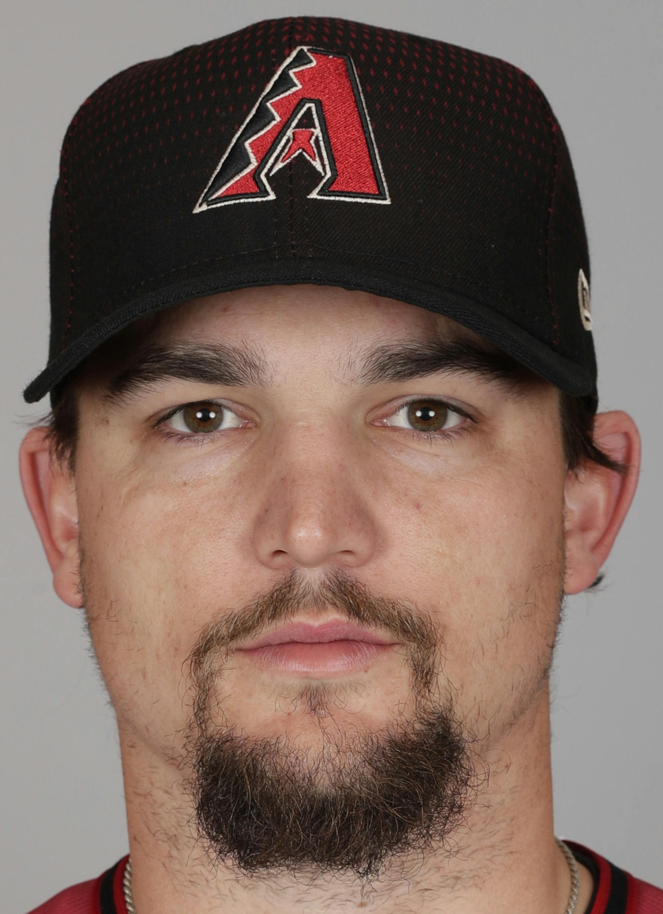 This is a 2017 photo of Zack Godley of the Arizona Diamondbacks baseball team. This image reflects the Arizona Diamondbacks' active roster as of Tuesday, Feb. 21, 2017, when this image was taken in Scottsdale, Ariz. (AP Photo/Matt York) ORG XMIT: AZMY
