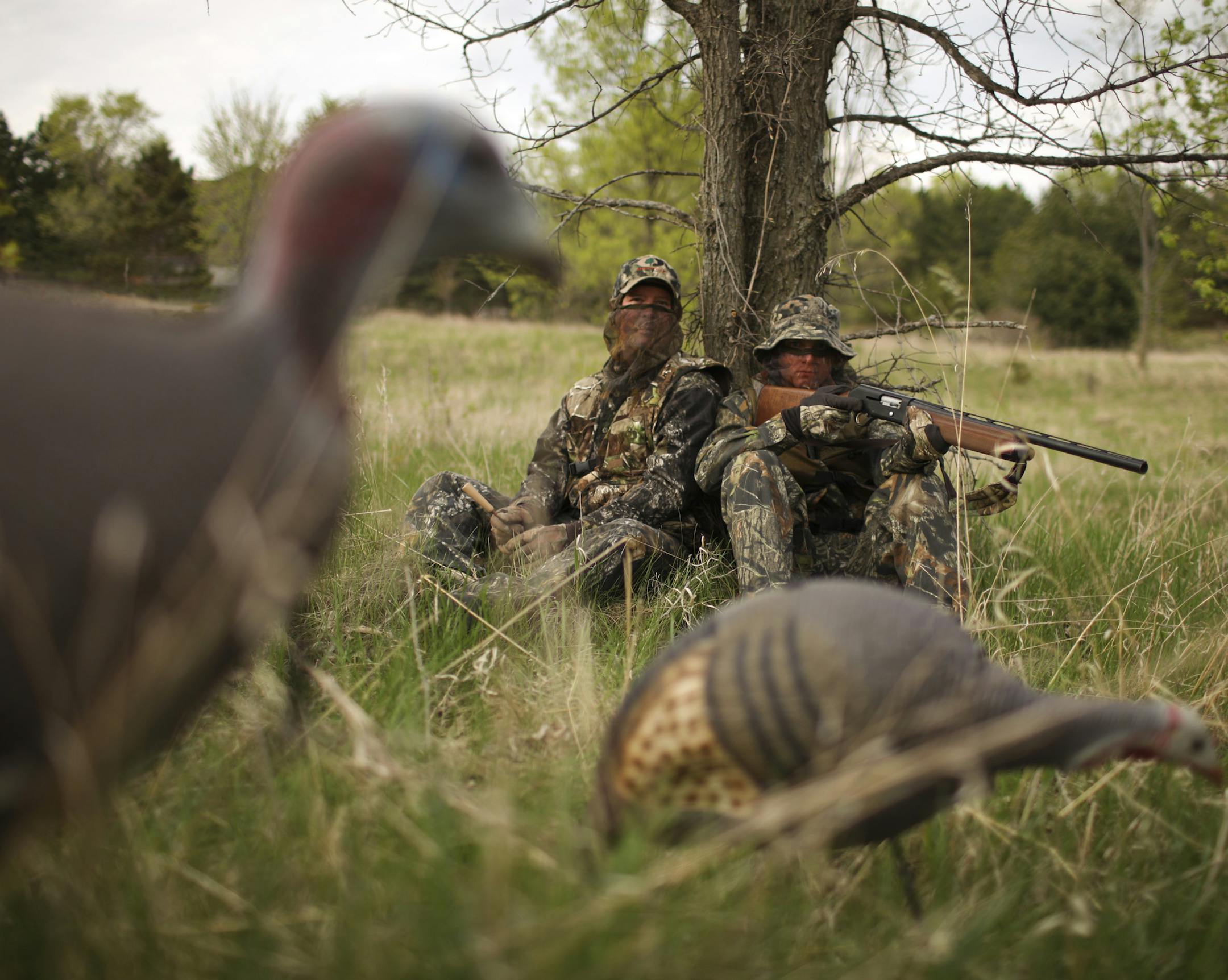 JEFF WHEELER ï jwheeler@startribune.com HUDSON - 5/11/09 - Andy Sexe has arranged for a wild turkey hunt for his son, Benjamin, 20, who is home between deployments as a U.S. Marine Corps reservist. IN THIS PHOTO: ] Andy, left, and Benjamin Sexe, in their gobbler garb near their home outside Hudson, WI Monday evening. ORG XMIT: MIN2013040508411118