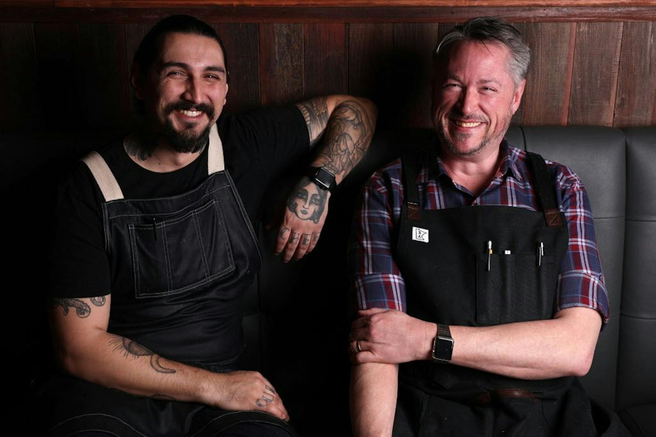 Shane Oporto and Tim McKee sat together for a portrait.