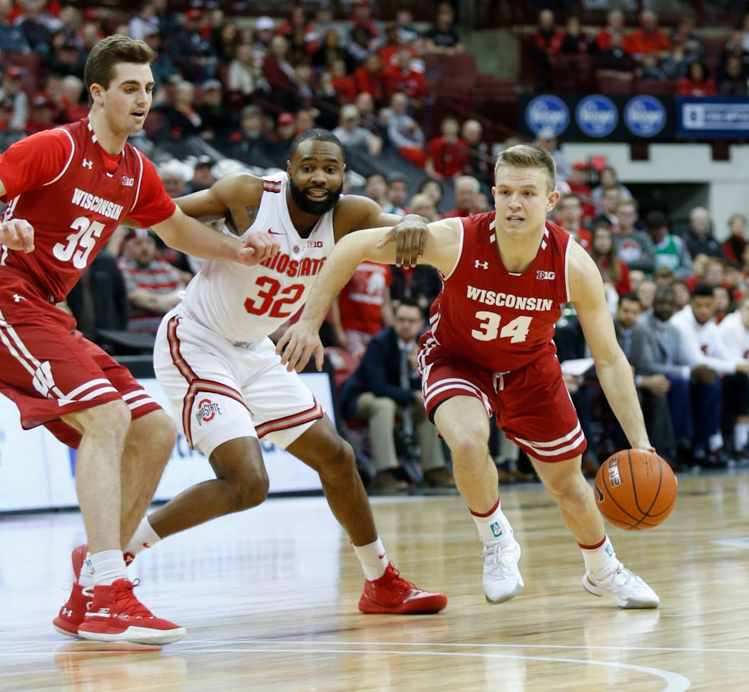 Wisconsin guard Brad Davison, right, and forward Nate Reuvers are key for the Badgers.