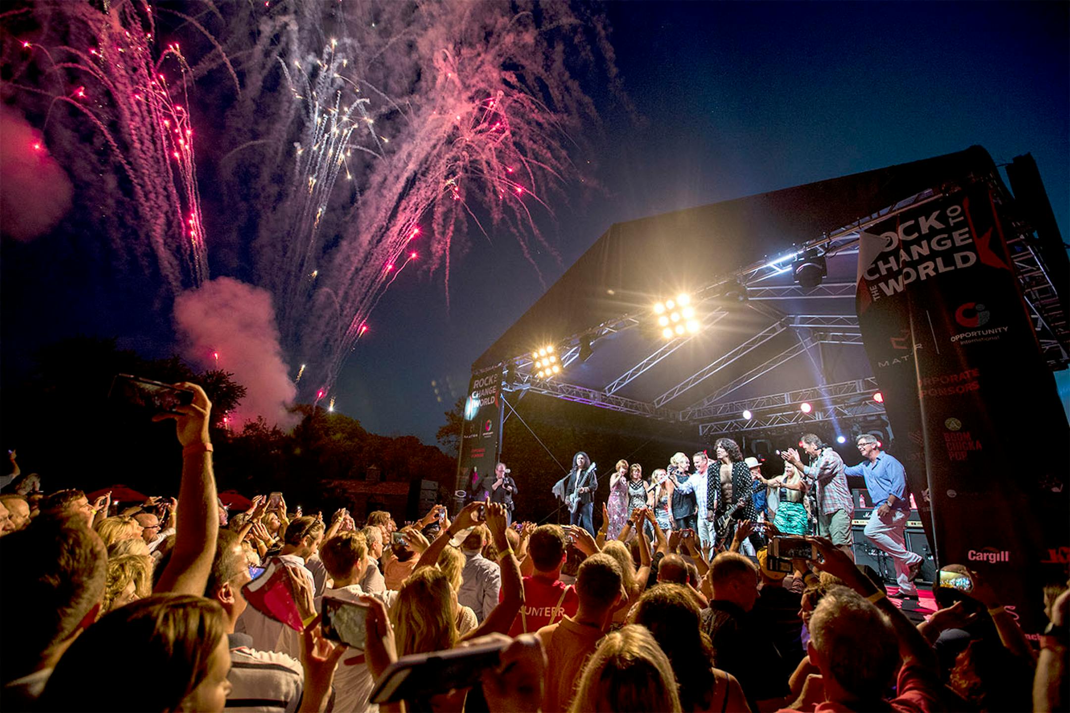Members of the crowd came on stage with Kiss as they performed their final song "I'm wanna to Rock N Roll all night" during a charity concert at philanthropist Martha "Muffy" MacMillan's home on Tuesday, August 2, 2016, in Long Lake, Minn.] RENEE JONES SCHNEIDER • renee.jones@startribune.com Not pictured is Eric Singer on drums.