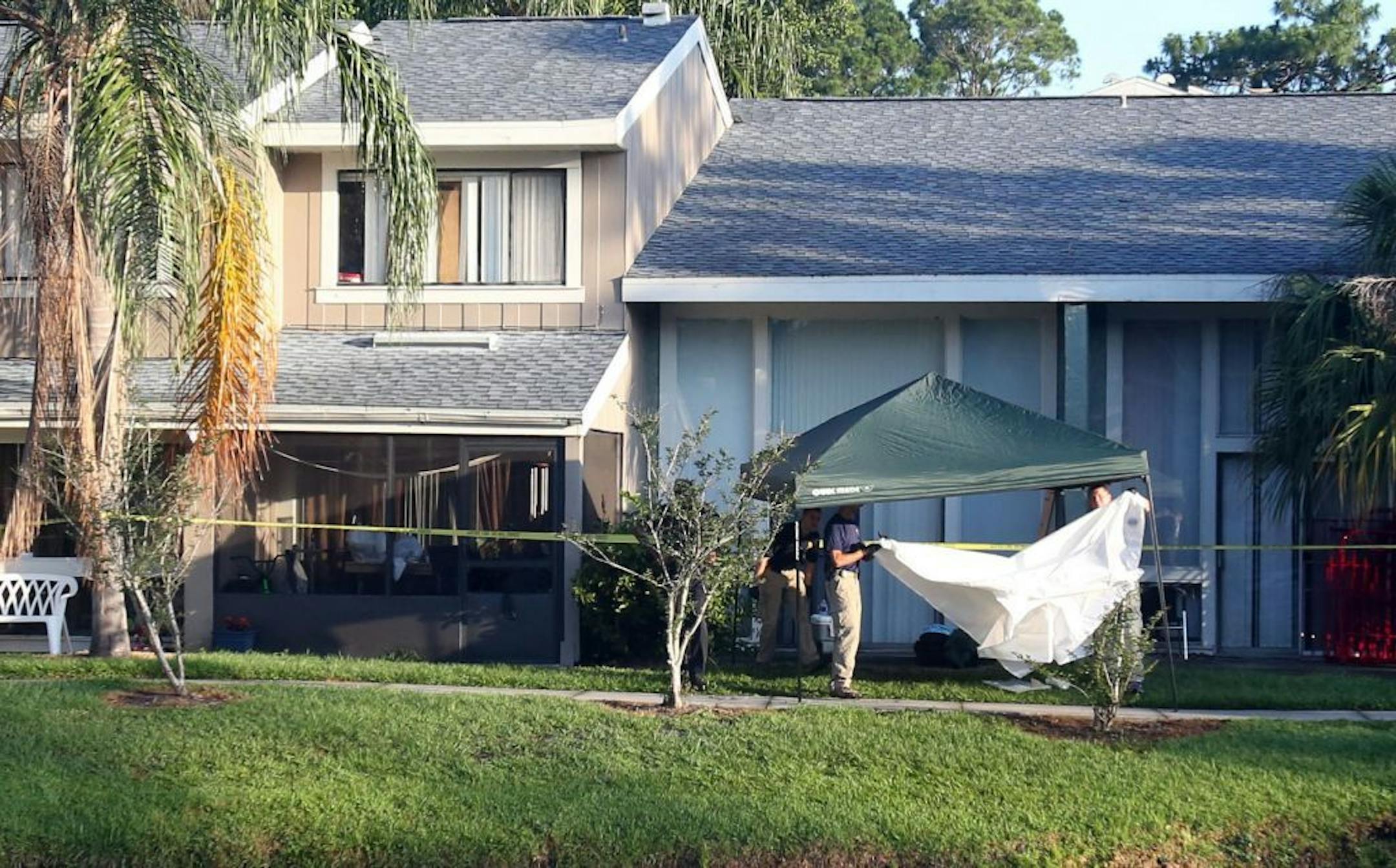FBI evidence response team gather in front of an apartment Wednesday, May 22, 2013 in Orlando, Florida, after an FBI agent shot and killed a man who was questioned in connection with the Boston Marathon bombings.