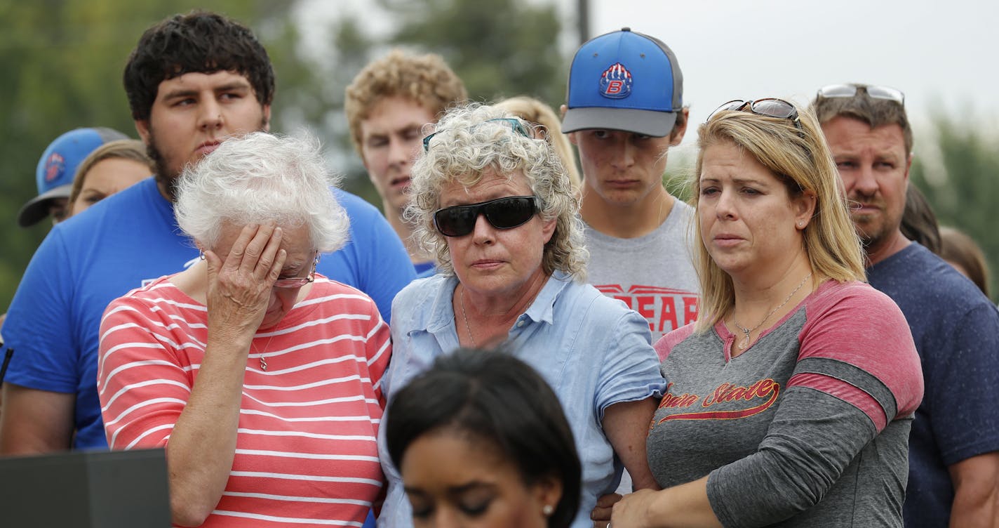 Friends and family of missing University of Iowa student Mollie Tibbetts react during a news conference, Tuesday, Aug. 21, 2018, in Montezuma, Iowa. Police say a man in the country illegally has been charged with murder in the death of Tibbetts, who was reported missing from her hometown in the eastern Iowa city of Brooklyn in July 2018. (AP Photo/Charlie Neibergall)