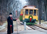 Bill Arends, playing the part of Ebenezer Scrooge stopped traffic at the Linden Hills Station so the Holly Trolly could pull safely into the station. Sunday, November 25, 2012. ] GLEN STUBBE * gstubbe@startribune.com