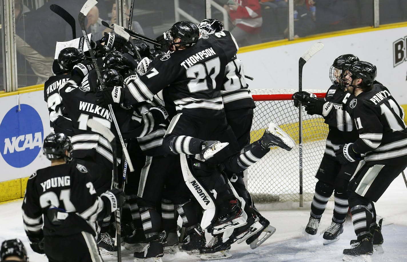 Providence players celebrate after defeating Cornell in the NCAA Division I East Regional final men's hockey game in Providence, R.I., Sunday, March 31, 2019. (AP Photo/Michael Dwyer)