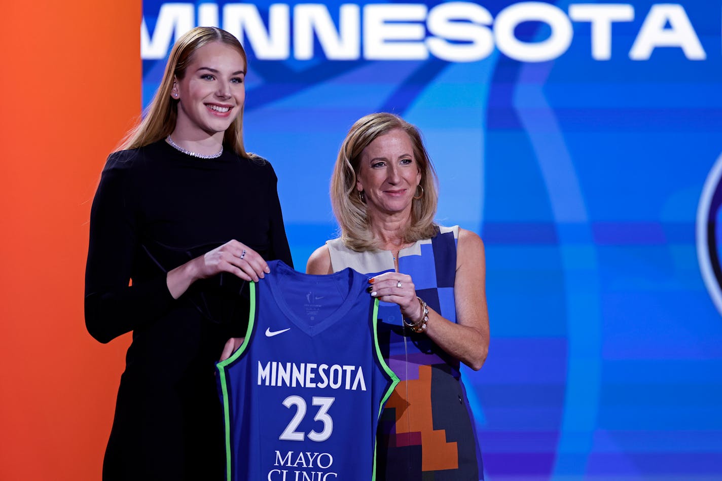 Connecticut's Dorka Juhasz, left, poses for a photo with commissioner Cathy Engelbert after being selected by the Minnesota Lynx at the WNBA basketball draft Monday, April 10, 2023, in New York. (AP Photo/Adam Hunger)