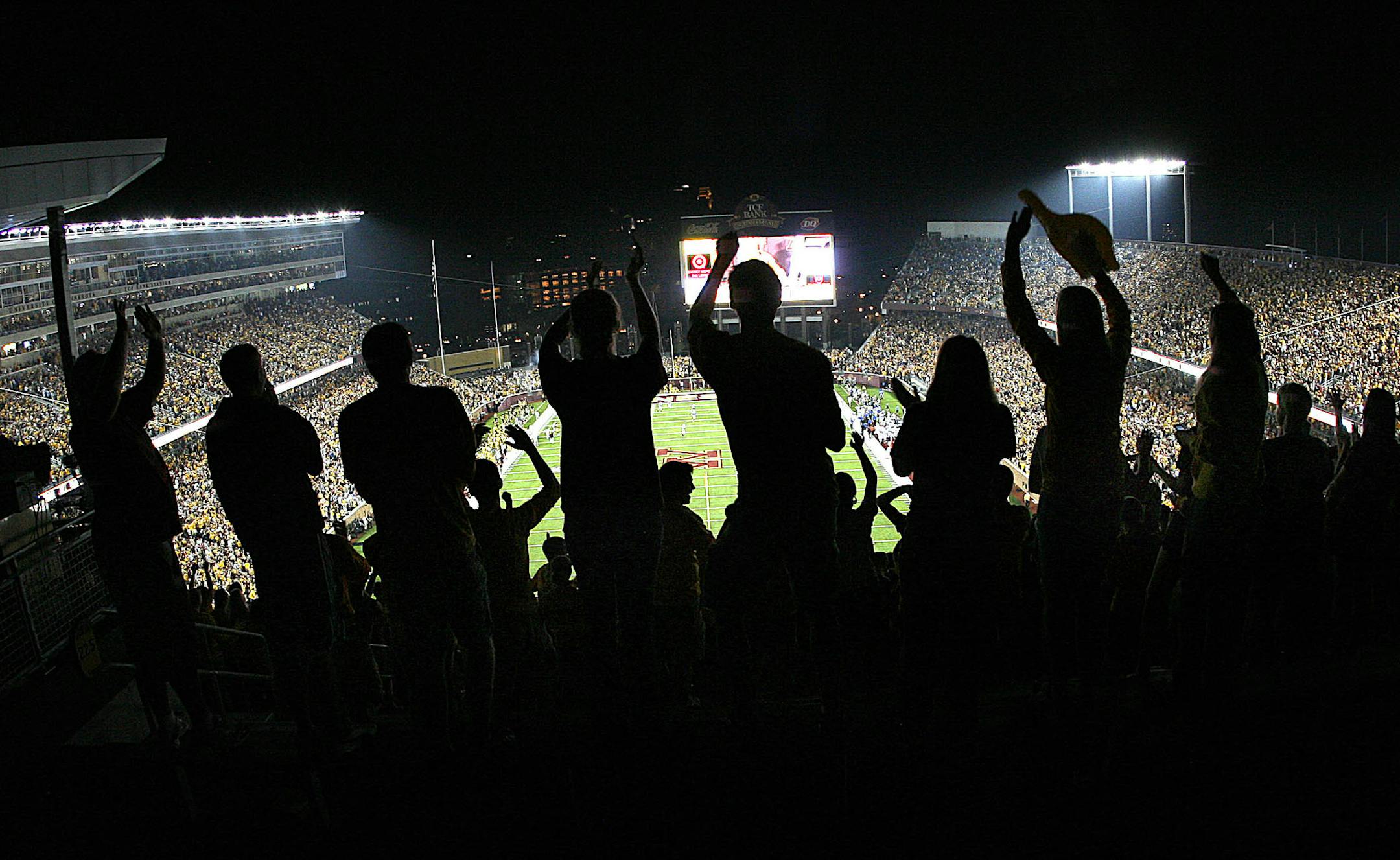 JIM GEHRZ • jgehrz@startribune.com Minneapolis/September 12, 2009/6:30 PM Fans in the student section cheer in the second half in the Gophers victory over Air Force at the new TCG Bank Stadium Saturday night. ORG XMIT: MIN2015090211542058