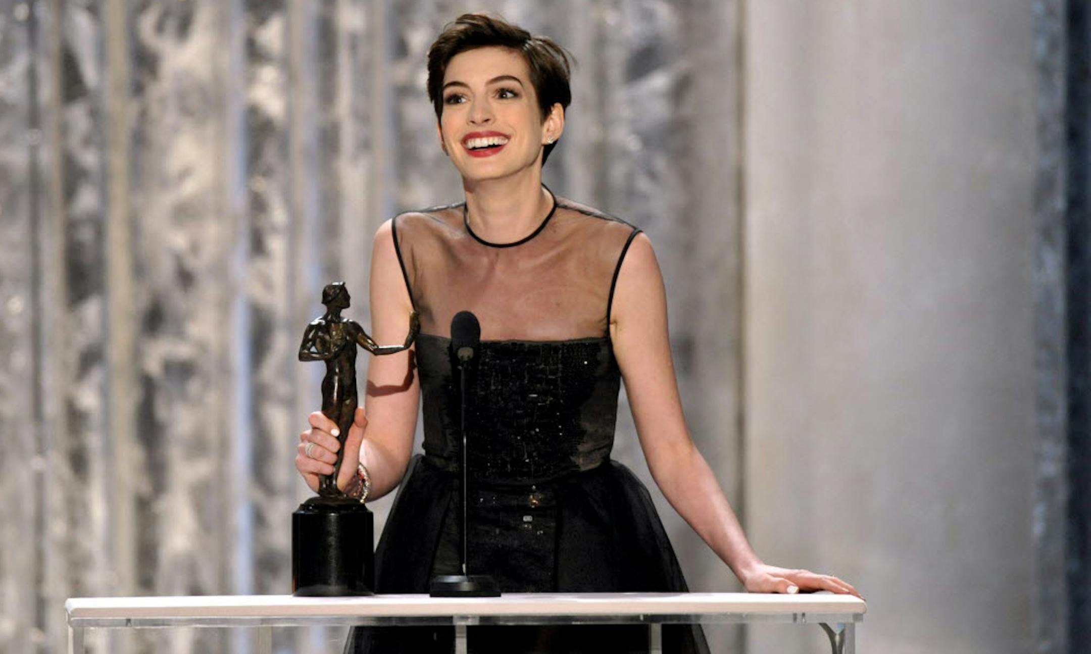 Anne Hathaway accepts the award for outstanding female actor in a supporting role for "Les Miserables" at the 19th Annual Screen Actors Guild Awards.
