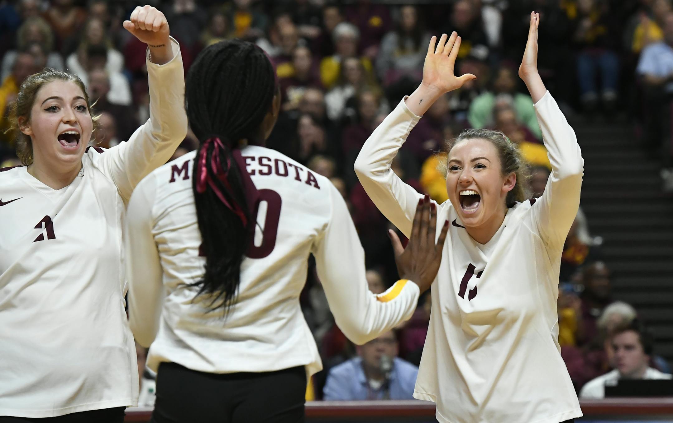 Gophers players including, from left, middle blocker Regan Pittman (21), outside hitter Adanna Rollins (20) and setter Samantha Seliger-Swenson (13) celebrated a third set point against Bryant Friday night. ] Aaron Lavinsky • aaron.lavinsky@startribune.com The University of Minnesota Golden Gophers volleyball team played the Bryant University Bulldogs in an NCAA Tournament game on Friday, Nov. 30. 2018 in the Maturi Sports Pavilion at the University of Minnesota in Minneapolis, Minn.
