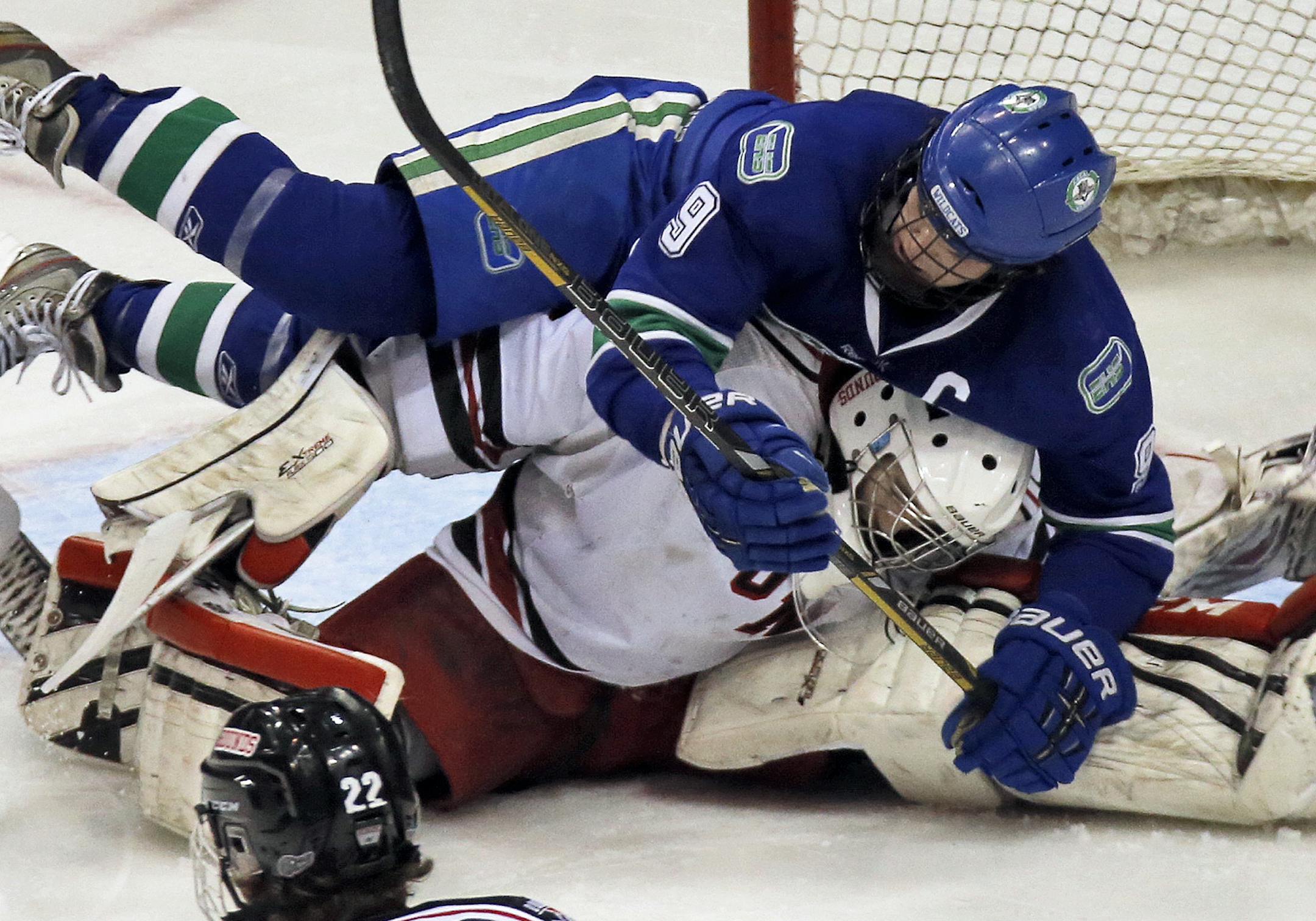 Eagan's Max Eisenheimer gets up close and personal with Duluth East goalie Gunnar Howg in 2nd period action. ] Boys State Highschool Hockey Tournament - Class 2A - Eagan Wildcats vs. Duluth East Greyhounds. (MARLIN LEVISON/STARTRIBUNE(mlevison@startribune.com)