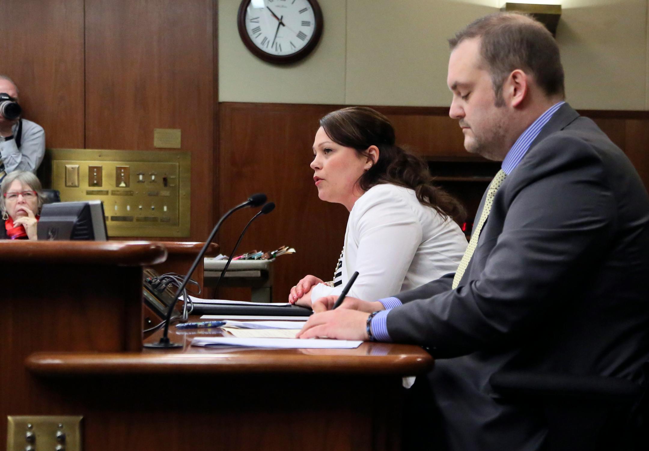 In this March 2014 file photo, Bree Adams, domestic violence advocate for St. Paul Intervention, spoke before a committee at the State Office in St. Paul. Seated next to her is Rep. Dan Schoen (DFL), author of the bill.