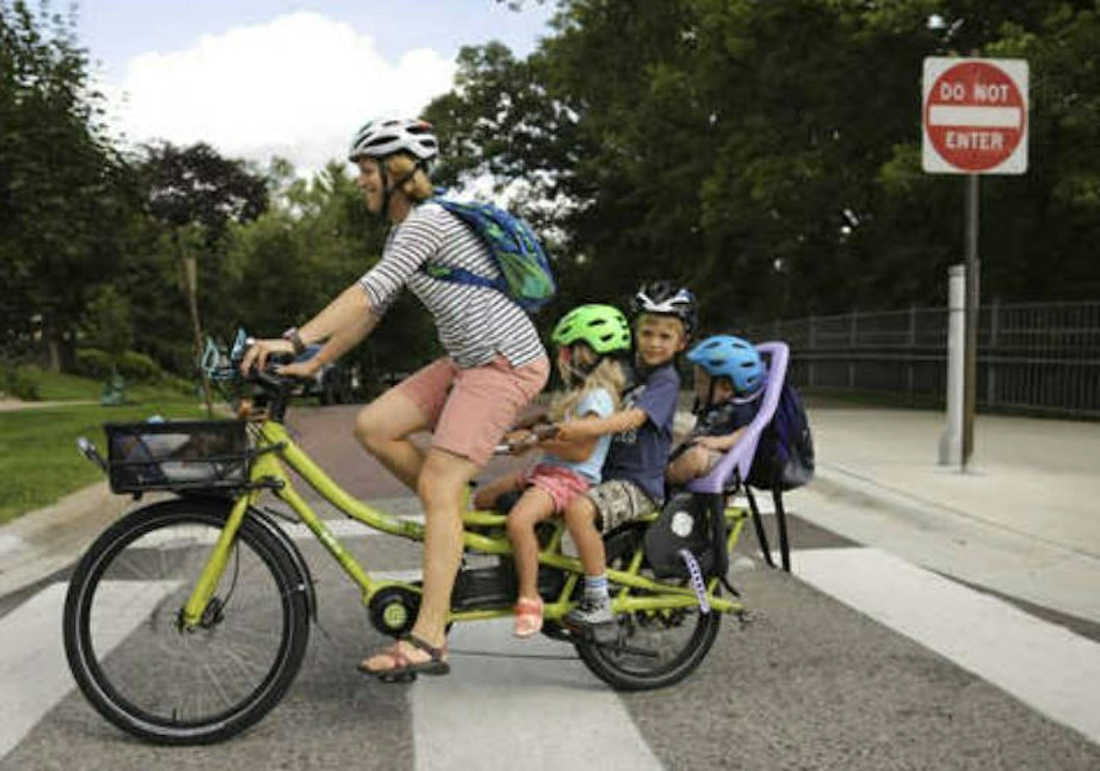 Stephanie Brodegard crossed W. Minnehaha Parkway as she biked with all her kids in tow.