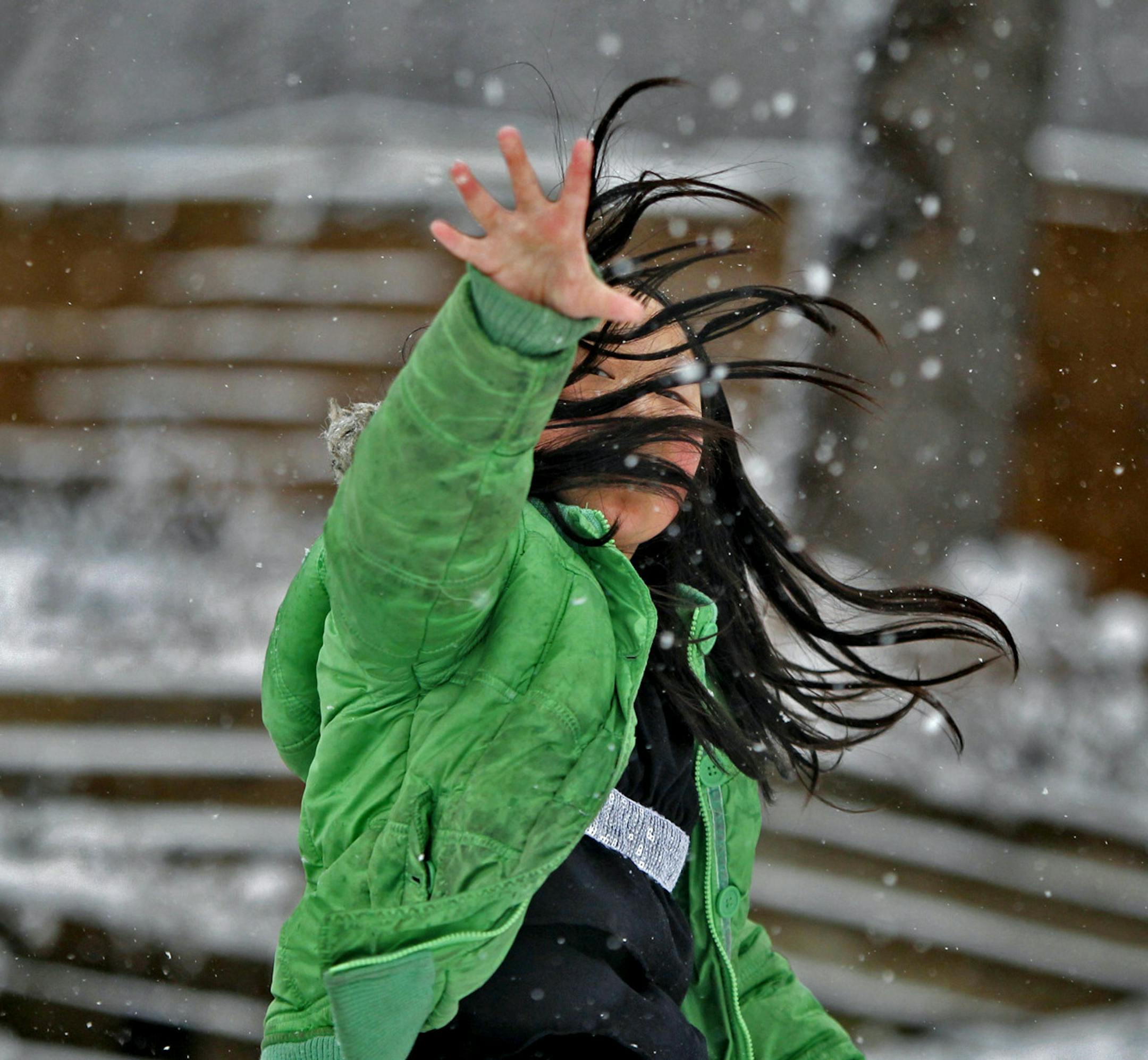Katie Moua, 9, was pleased to be wearing a winter coat and having a snowball fight with her little brother Zachary, 4, near the Minnesota border, Thursday, April 11, 1013. (ELIZABETH FLORES/STAR TRIBUNE) ELIZABETH FLORES &#x201a;&#xc4;&#xa2; eflores@startribune.com