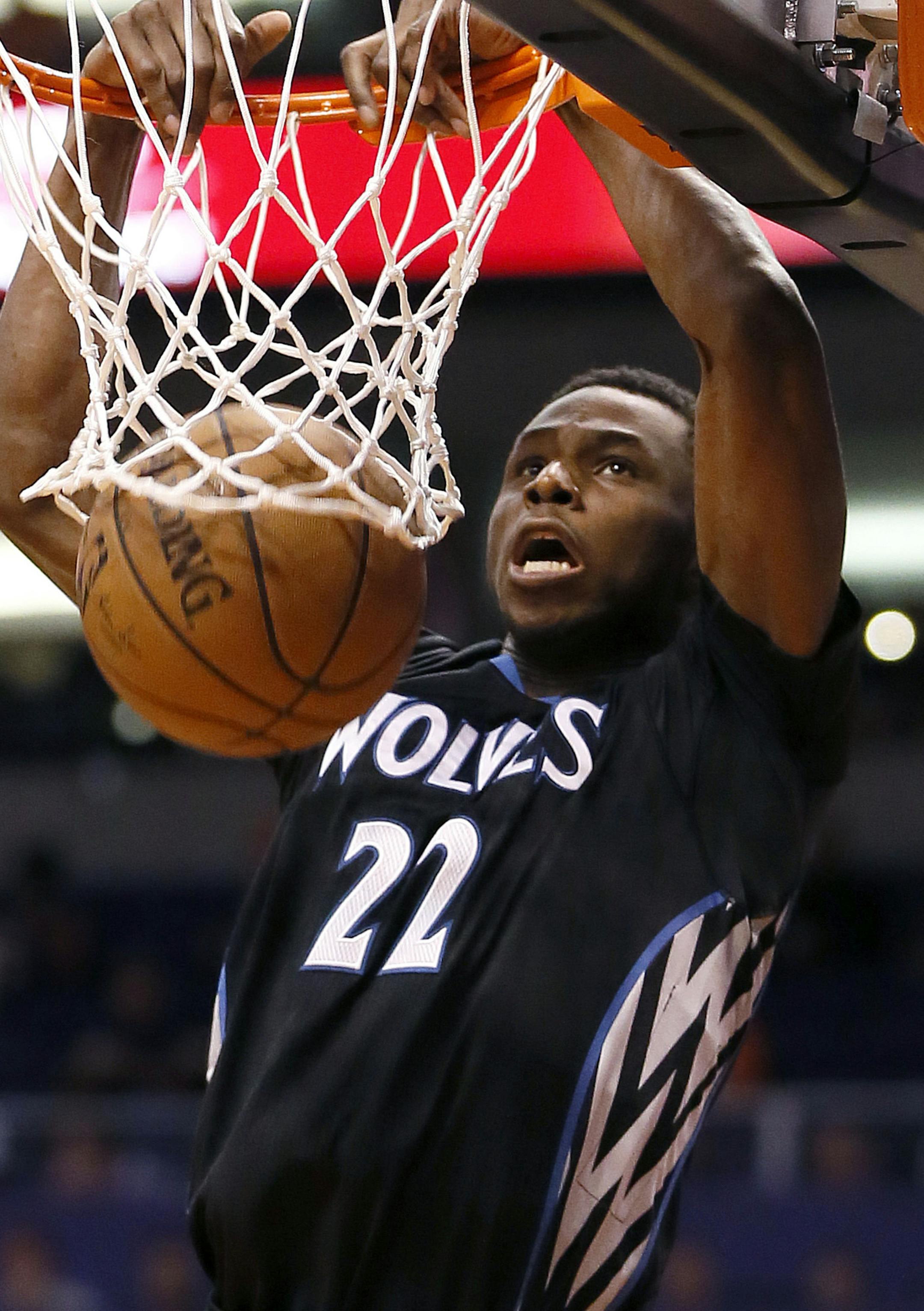 Minnesota Timberwolves' Andrew Wiggins dunks against the Phoenix Suns during the first half of an NBA basketball game, Friday, Jan. 16, 2015, in Phoenix. (AP Photo/Matt York)