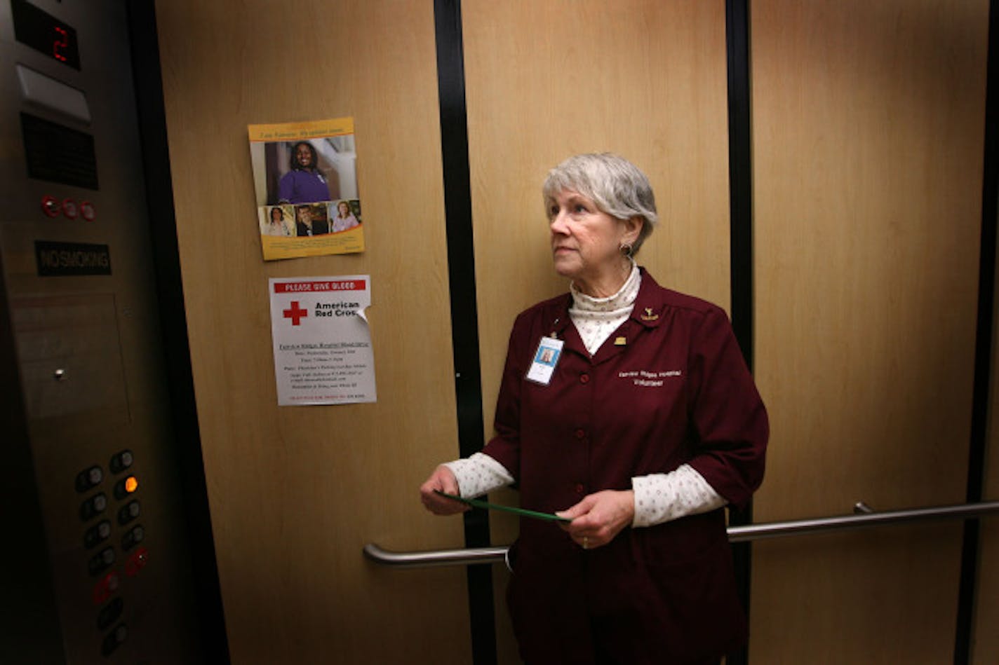 Volunteer Nancy Stevens made her way to a patient's room to deliver an e-card.