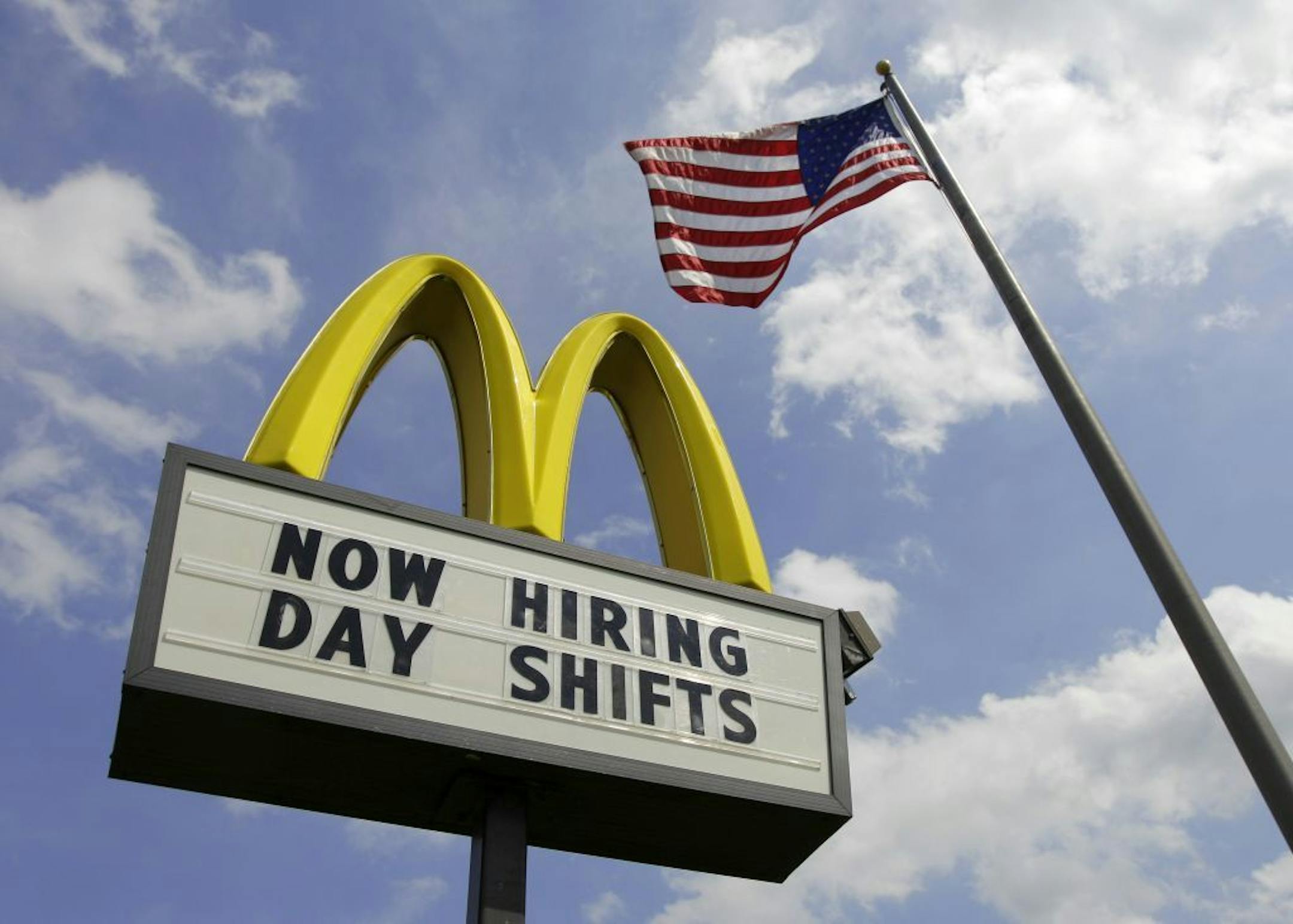 FILE- This May 2, 2012, file photo shows a sign advertising job openings outside a McDonalds restaurant in Chesterland, Ohio. McDonald's said a key sales figure climbed 3.7 percent in August, as the fast-food chain emphasized the value of its menu offerings amid the challenging global economy