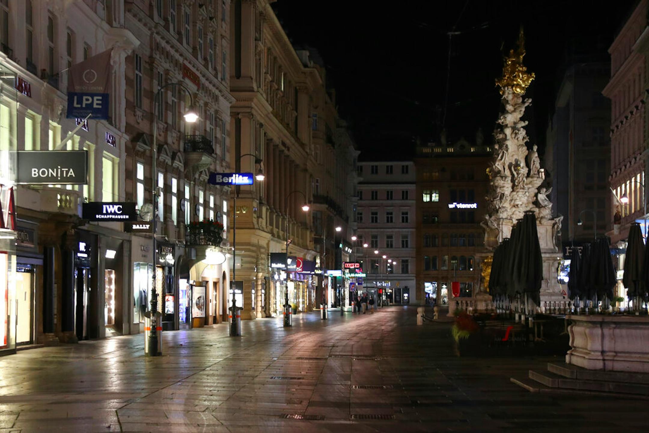 People walk through the deserted city in Vienna, Austria, Tuesday, Nov. 3, 2020.