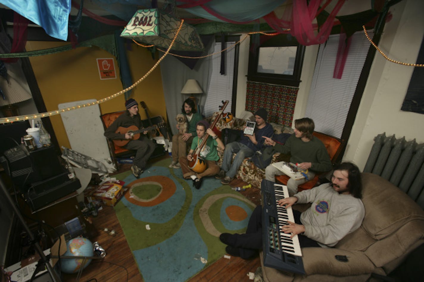 The living room: Sharing a punk house with fellow musicians is fun and musically stimulating, according to the housemates. "We trade ideas back and forth. It's like a brotherhood," said Tyler Peterson. Left to right: Jonathan Coe, Jonathan Delehanty, Peterson, Andy Fritz, Seth Rosetter and Aaron Baum.