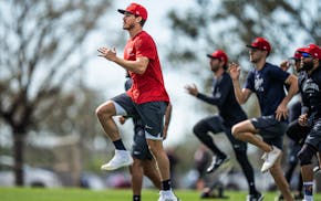 Starting pitcher Joe Ryan (in red) and the rest of the Twins, shown working out Wednesday in Fort Myers, Fla., need to stay healthy if the team is to