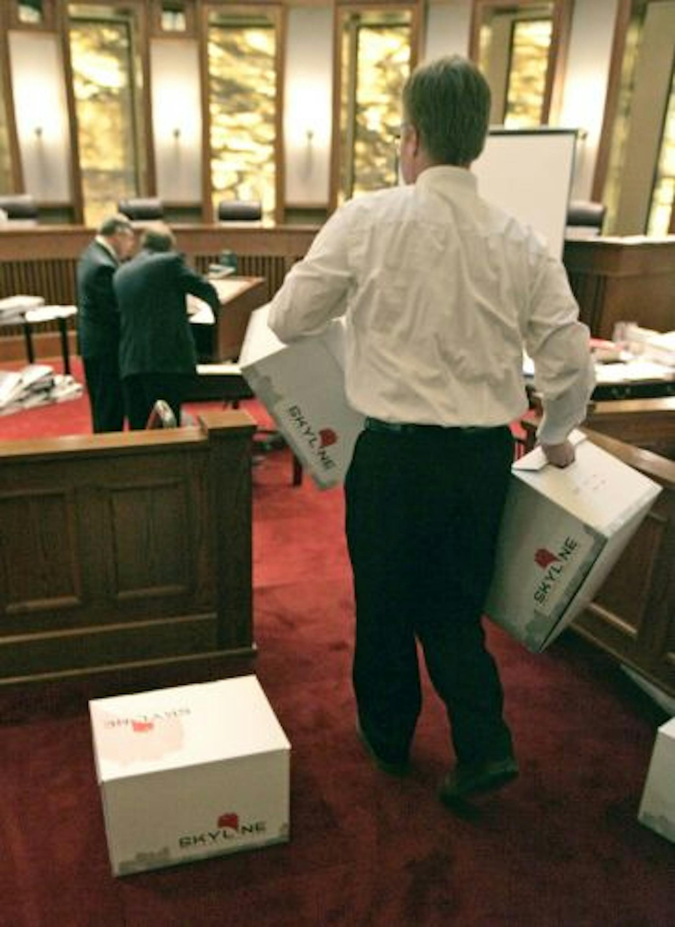 Boxes of exhibits were brought into the courtroom prior to the start of the Senate recount trial Tuesday.