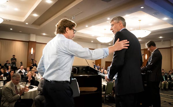 DFL challenger Dean Phillips and Rep. Erik Paulsen greeted each other at the end of Tuesday's third district debate. ] GLEN STUBBE � glen.stubbe@sta