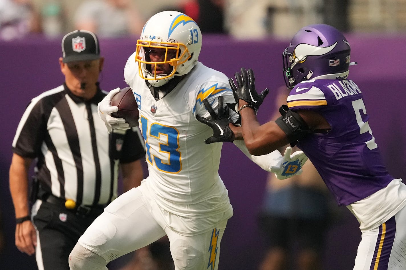 Los Angeles Chargers wide receiver Keenan Allen (13) pushes off the tackle by Minnesota Vikings cornerback Mekhi Blackmon (5) in the second quarter of an NFL game between the Minnesota Vikings and the Los Angeles Chargers Sunday, Sept. 24, 2023 at U.S. Bank Stadium in Minneapolis. ] ANTHONY SOUFFLE • anthony.souffle@startribune.com