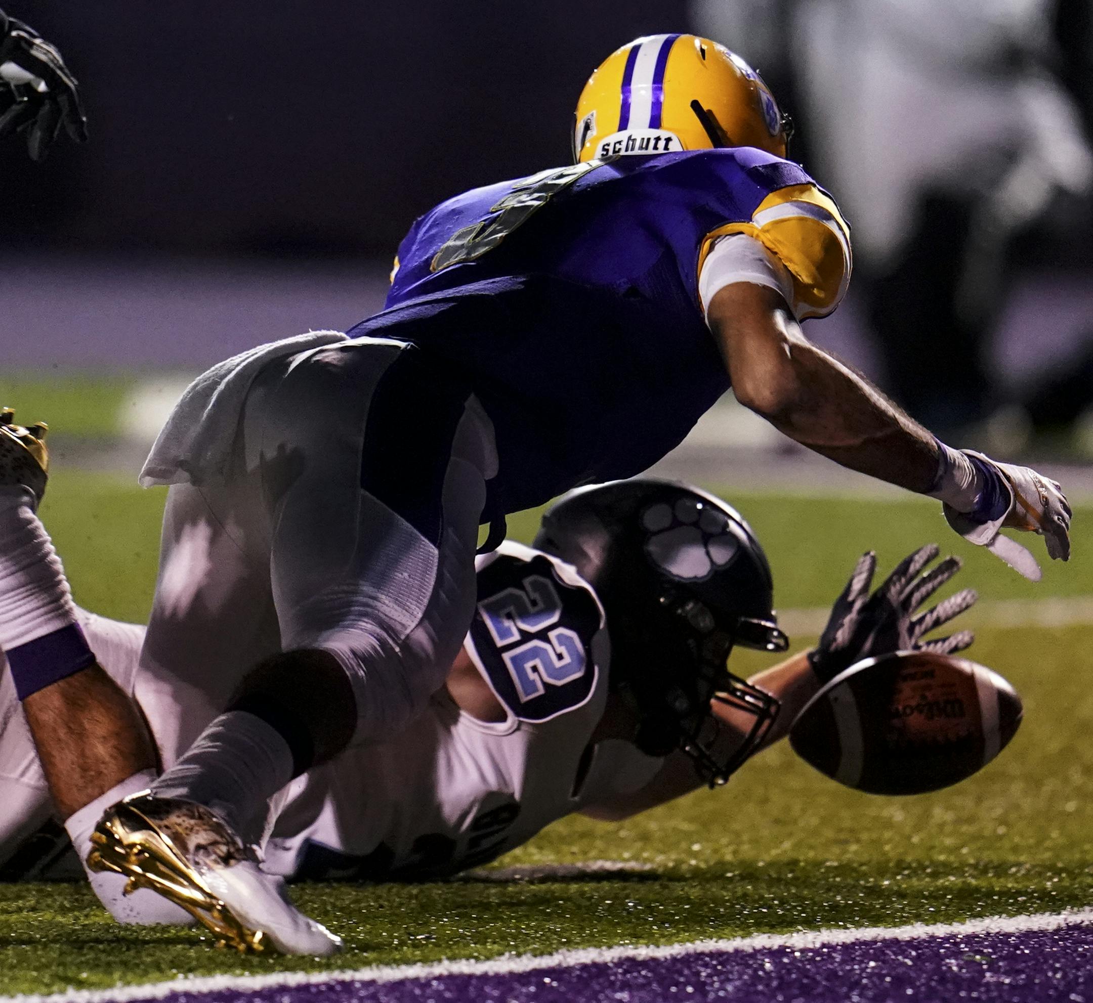 Cretin-Derham Hall Peter Udoibok (3) fumbled the ball, leading to a turnover as Blaine defensive back Jason Kaul (22) scooped it up along the goal line for a touchback. ] AARON LAVINSKY &#x2022; aaron.lavinsky@startribune.com
Cretin-Derham Hall played Blaine in a football game at the University of St. Thomas on Friday, Sept. 21, 2018 in St. Paul, Minn..