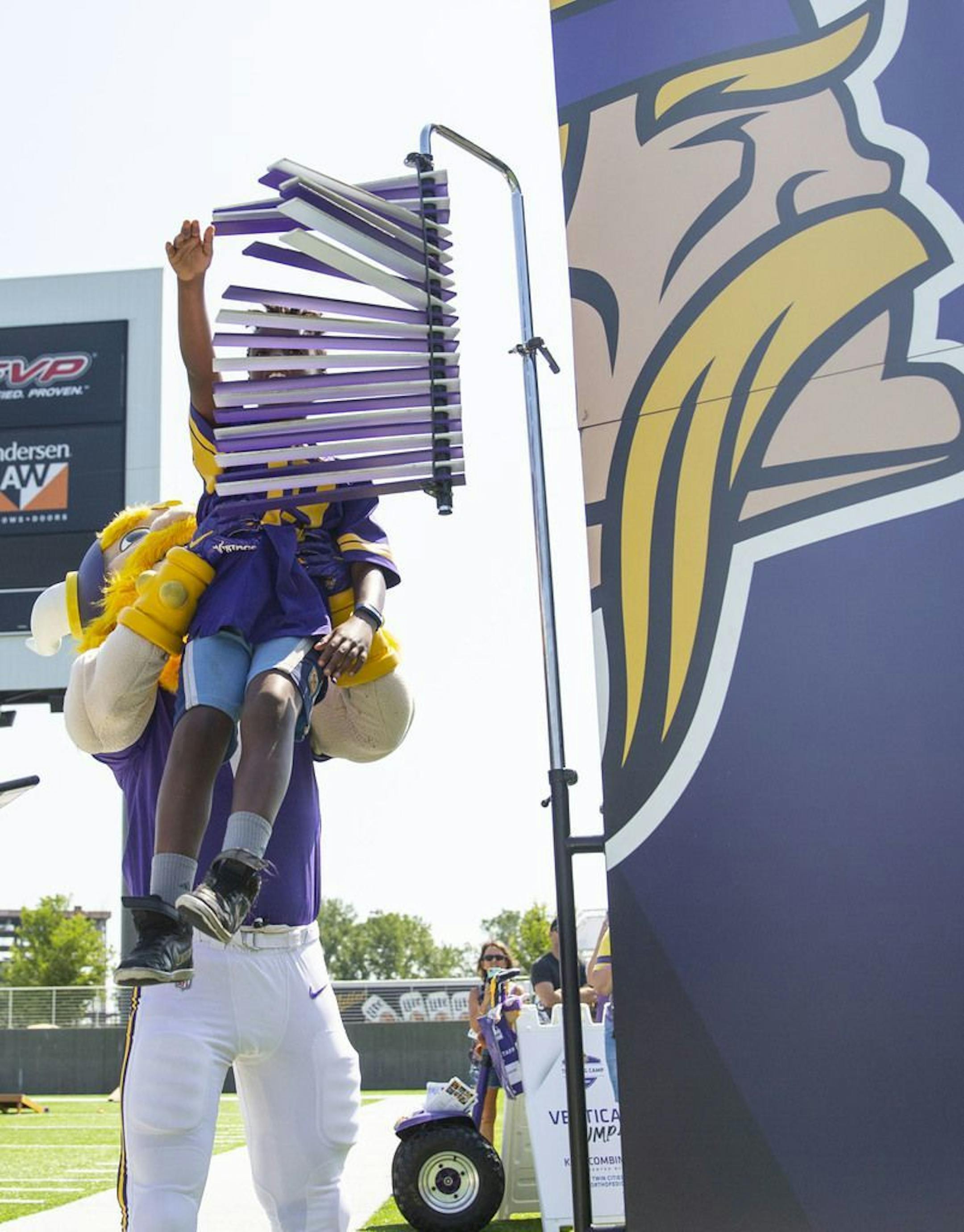 Viktor the Viking, the Minnesota Vikings mascot, snuck up behind Jacob Sykes and lifted him up during his attempt at the high jump. ALEX KORMANN • alex.kormann@startribune.com The Minnesota Vikings opened up their first full day of training camp on Friday July 26, 2019 at TCO Performance Center in Eagan, MN. Doors opened to fans at 11AM to watch their favorite players practice and get excited for the 2019 NFL season.