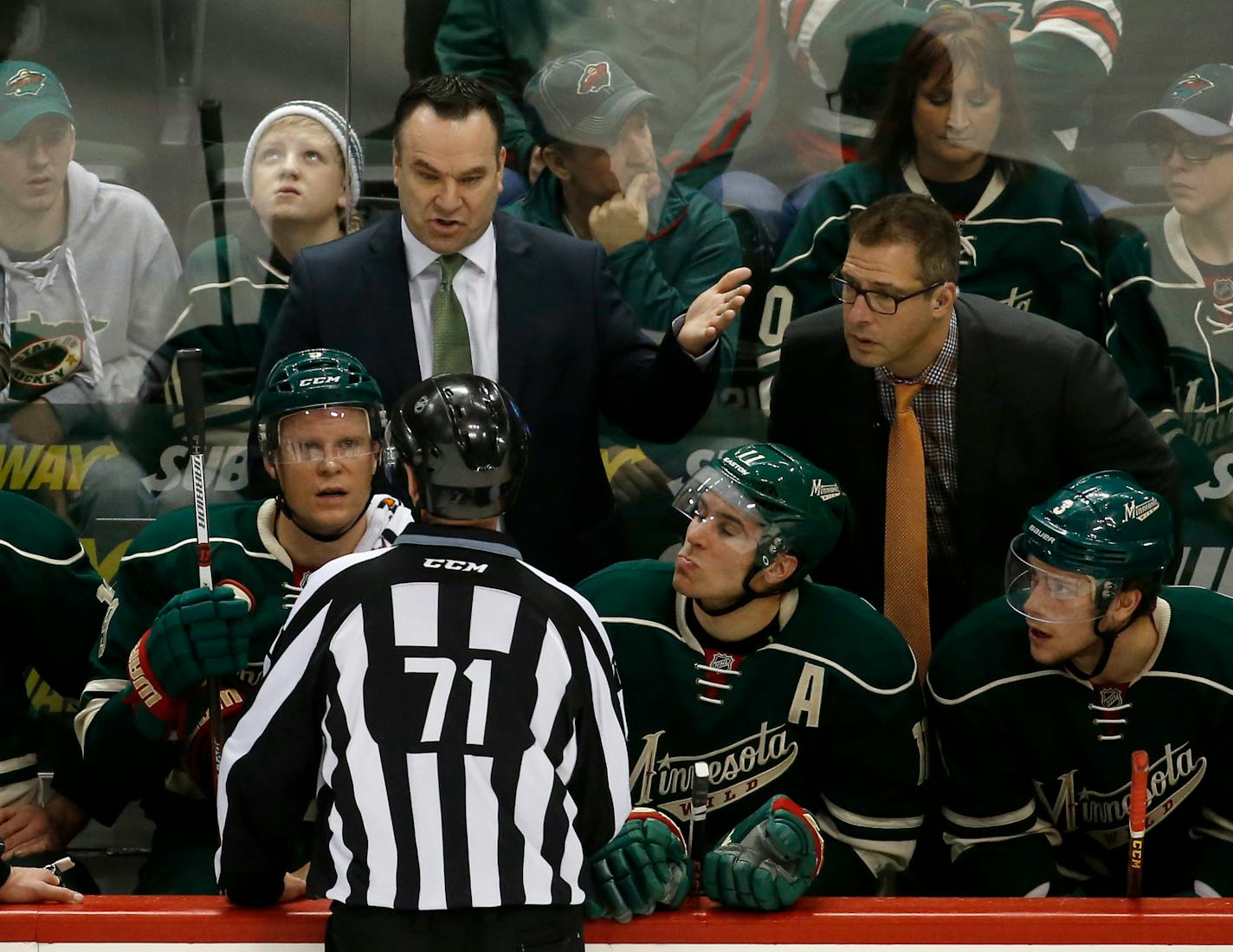 Wild interim coach John Torchetti questioned linesman Brad Kovachik during the first period against the St. Louis Blues on Sunday night.