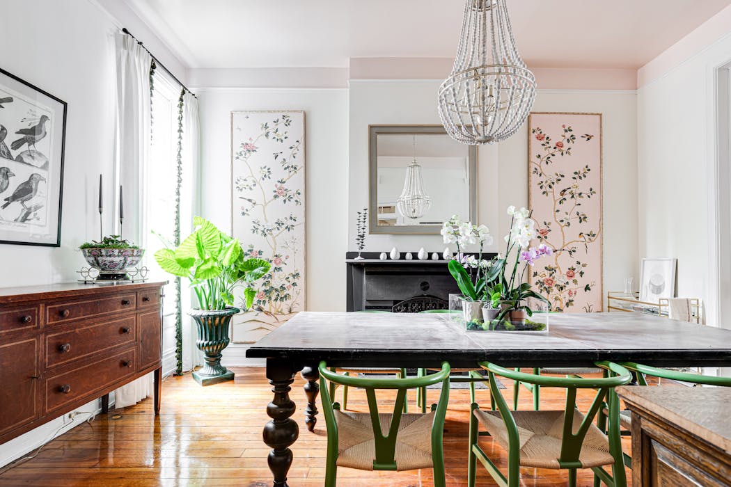 The chinoiserie panels flanking the fireplace in Stevie McFadden’s dining room were decor from a black-tie event she attended with friends last spring. She purchased them the next morning after a bit of haggling.