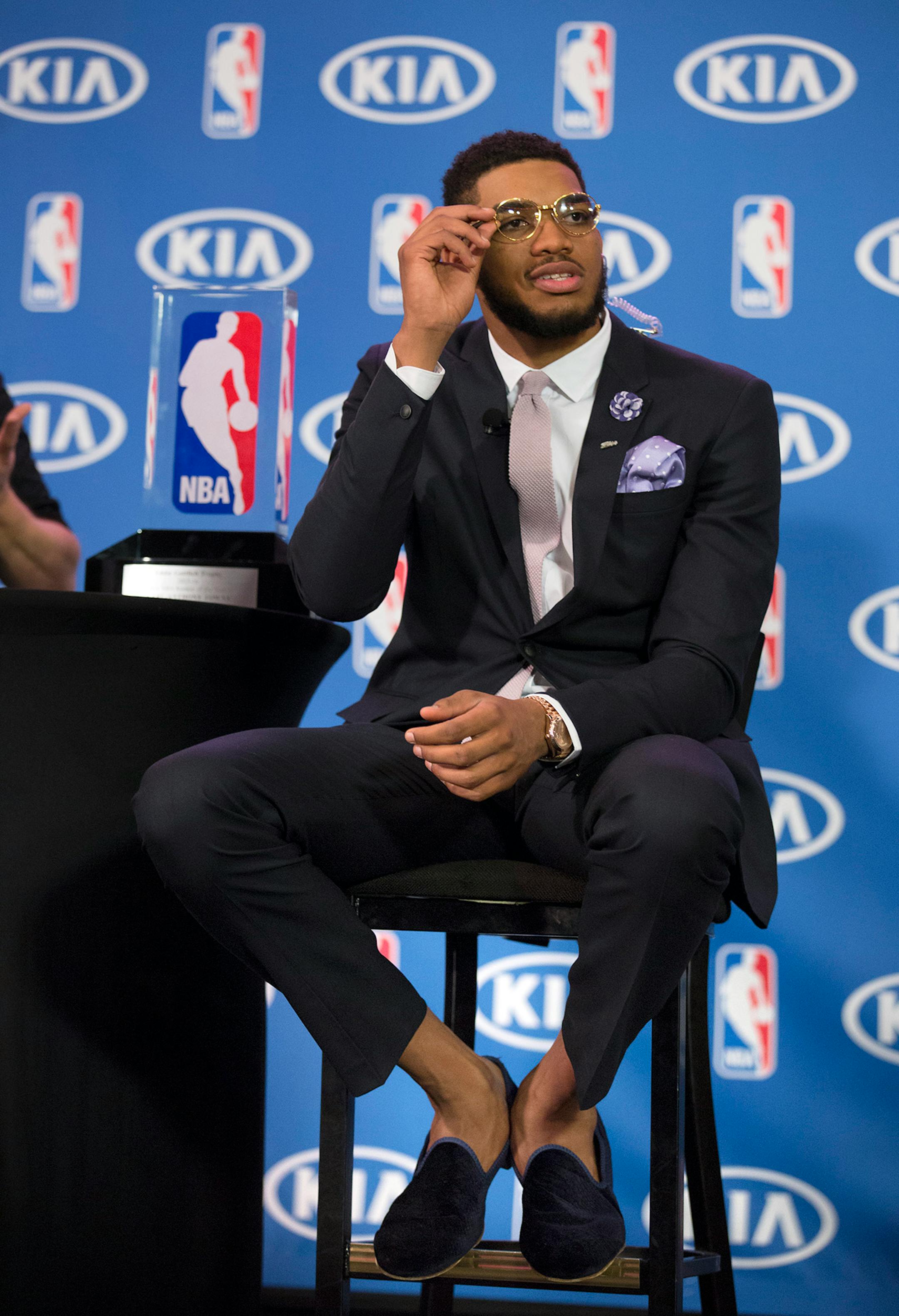 Whith his vintage glasses and sockless style, Karl-Anthony Towns waits for an interview with ESPN after the announcement of his NBA Rookie of the Year Award.