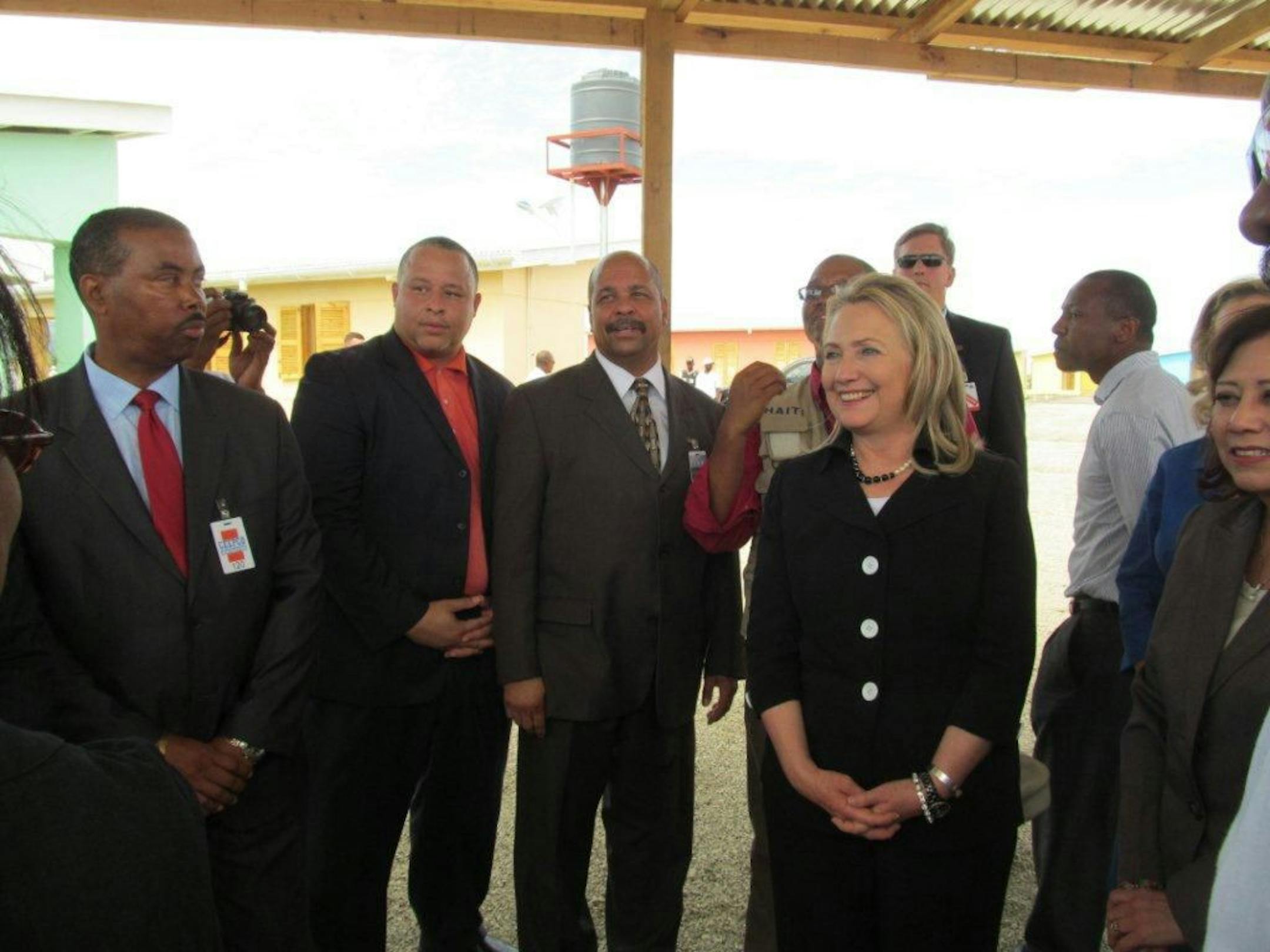 Ravi Norman, second from left, and Richard Copeland, center, of Thor Construction with Hillary Clinton.