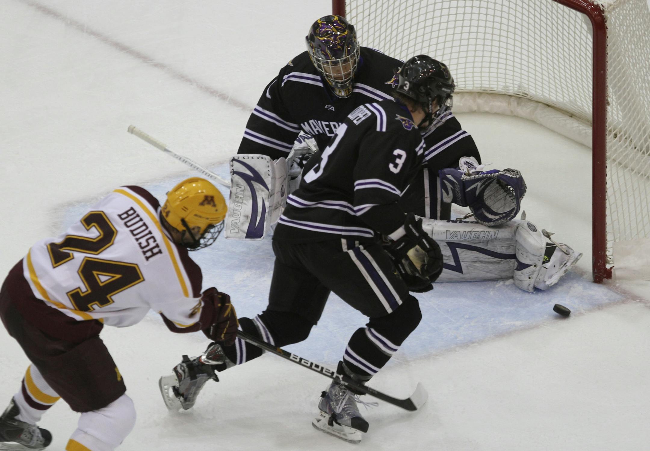 Gopher's Zach Budish took a shot at the net with Maverick goalie Austin Lee defending during the second period at Mariucci Arena in Minneapolis, Min., Friday, December 2, 2011.
