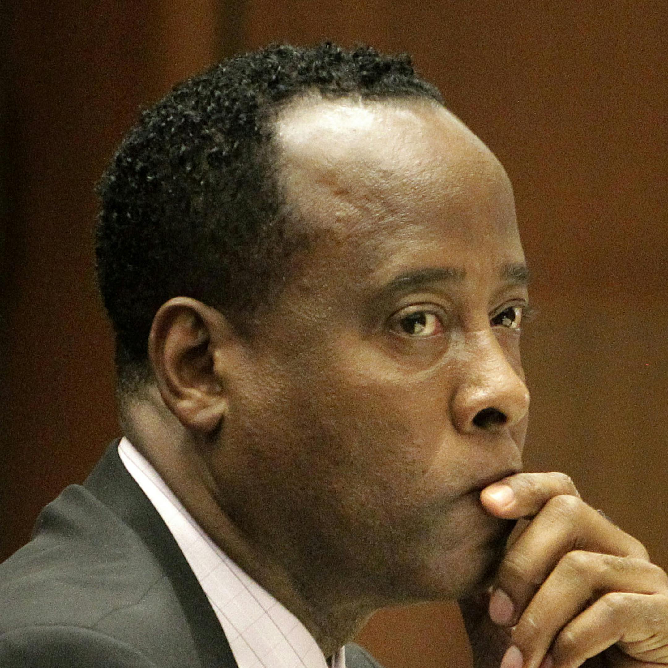 FILE - In this Friday, Oct. 21, 2011, file photo, Michael Jackson's former doctor Conrad Murray sits in a courtroom during his involuntary manslaughter trial in Los Angeles. Murray, who was convicted of killing Michael Jackson, was released from jail Monday, Oct. 28, 2013, after serving nearly two years of a four-year sentence. A change in California law allowed his incarceration time to be significantly cut down. (AP Photo/Reed Saxon, Pool, File)