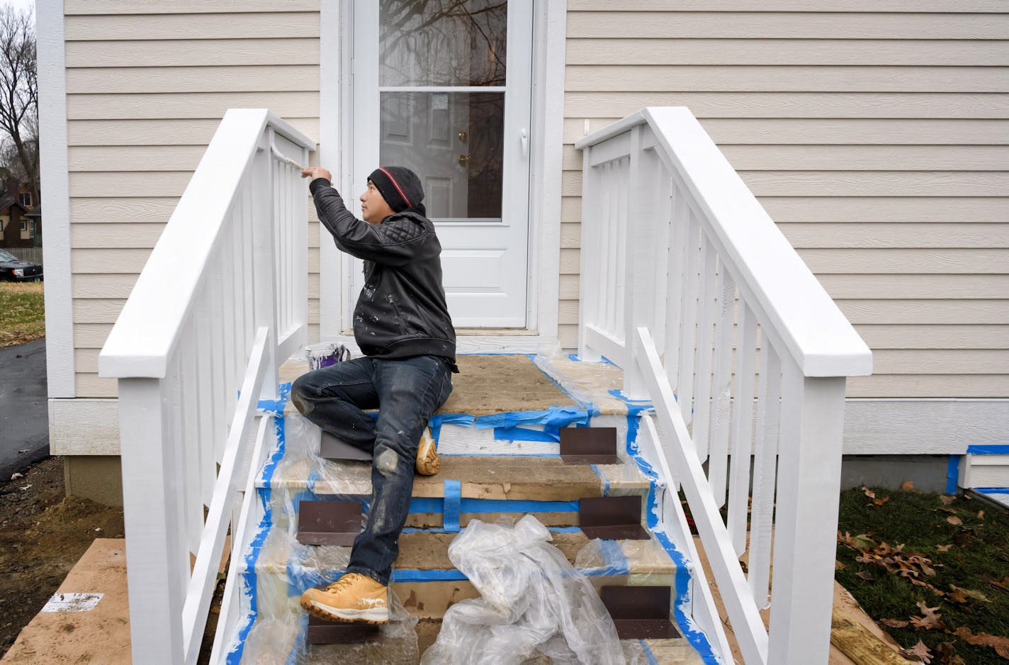 Future Habitat home buyer Sy Her painted the rear entrance of at a Habitat for Humanity house in North Minneapolis. Instead of a down payment Habitat buyers are required to complete at least 400 hours of sweat equity towards the building of Habitat homes. ] GLEN STUBBE &#x2022; glen.stubbe@startribune.com Monday, November 13, 2017 Some of Minnesota's biggest nonprofits are capitalizing on the momentum of Give to the Max Day, while diverting established donors to their own personal giving website