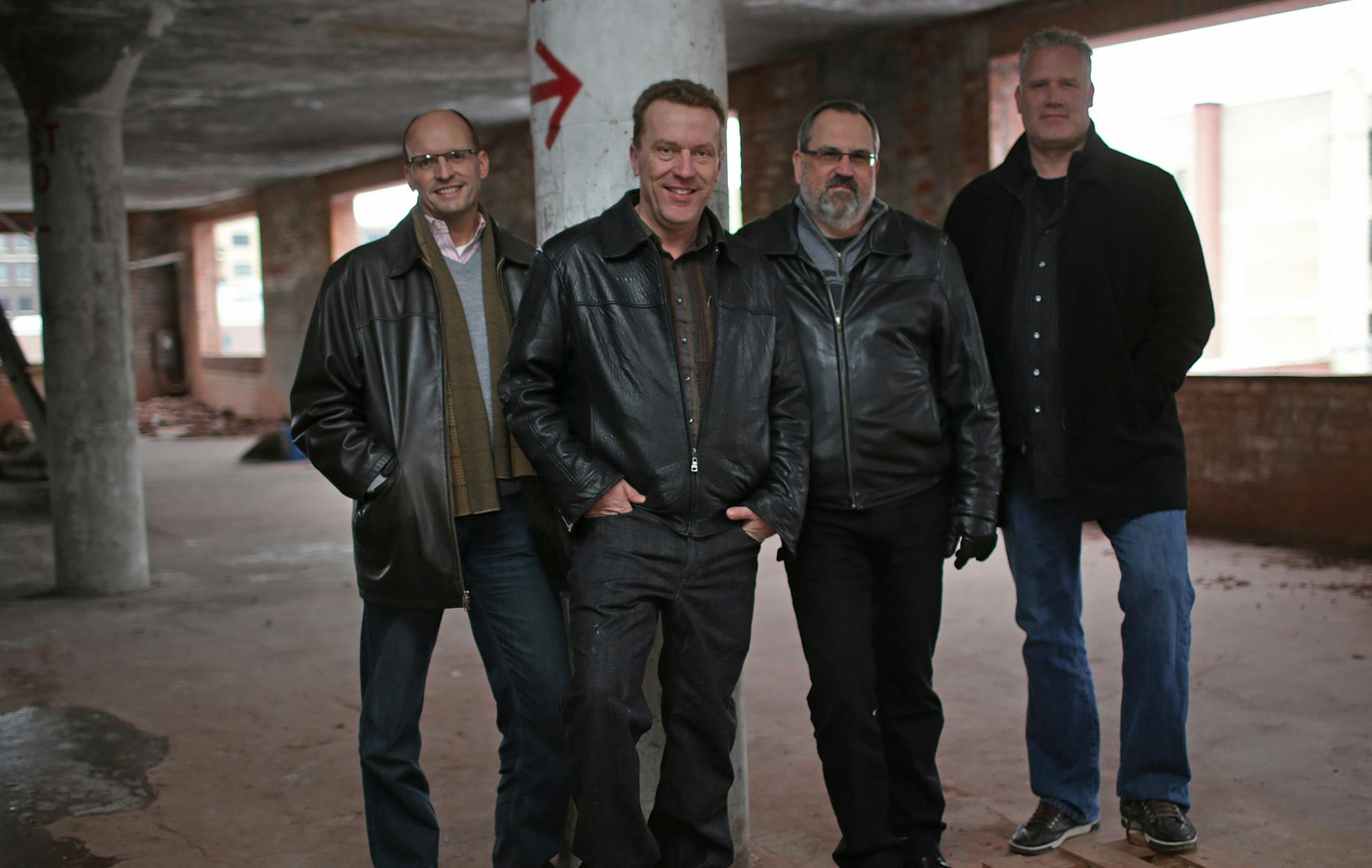 (l-r) Pat Hagen, Jim Simpson, Klay DeVries and Matt Christianson, of Crelow LLC, photo taken at Western Container building, Minneapolis, presently undergoing renovation. ] A Minneapolis start-up is launching a site that promises to revolutionize the commercial real estate market. An interested tenant and a building owner currently operate with a broker each. This site cuts out one of those layers and plays matchmaker between the tenant and office space. It's the only such software in the country