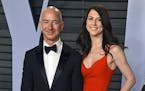 FILE - In this March 4, 2018 file photo, Jeff Bezos and his then-wife MacKenzie Bezos arrive at the Vanity Fair Oscar Party in Beverly Hills, Calif. T
