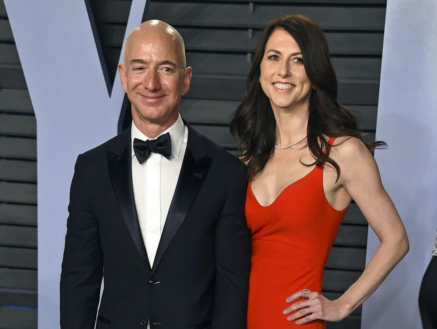 FILE - In this March 4, 2018 file photo, Jeff Bezos and his then-wife MacKenzie Bezos arrive at the Vanity Fair Oscar Party in Beverly Hills, Calif. They are now divorced.