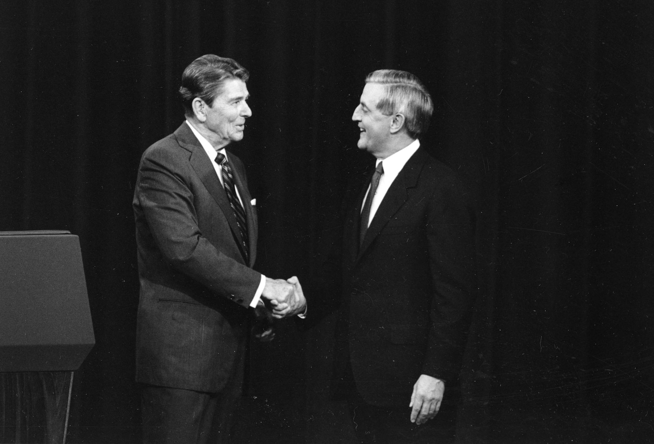 FILE - In this Oct. 22, 1984, file photo, President Ronald Reagan, left, and his Democratic challenger Walter Mondale, shake hands prior to their televised presidential debate, in Kansas City, Mo. When Reagan won the White House in 1980, he was 69 _ the oldest man ever elected to the office. During his successful 1984 re-election campaign, he faced questions about his age in his head-to-head contest with 56-year-old Walter Mondale, the former vice president. They spend hours mastering policy. Le