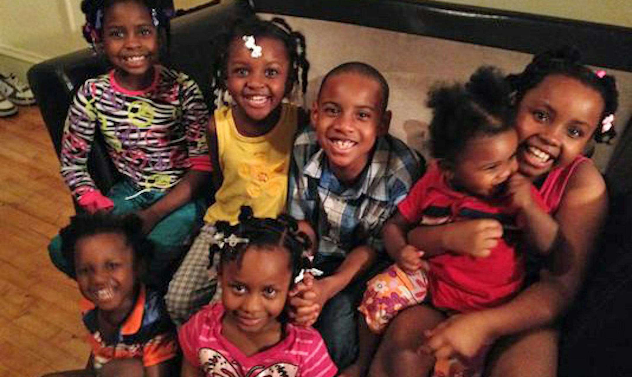 The Lewis family children. In front: Troy, left, and Electra. In back from left: Mary, Fannie, Christopher, Gwendolyn and Shaca. Only Electra and Shaca among the Lewis children survived the fire.