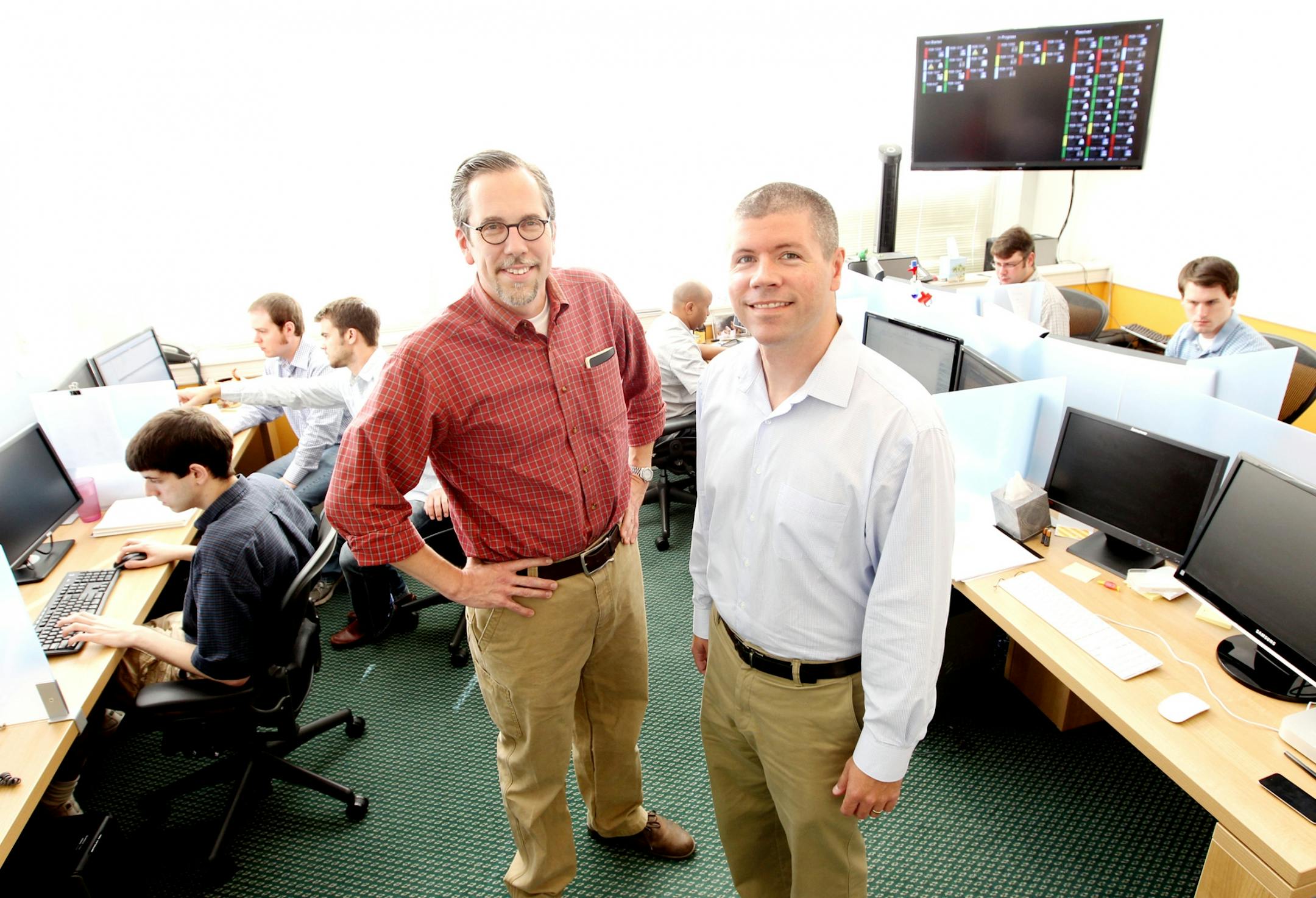 Reeher President and CEO Andy Reeher, left, and vice-president and CFO Rod O'Connor sell a software service called the Reeher Platform that helps universities and colleges better target donors. Photographed at their St. Paul office September 13, 2012.