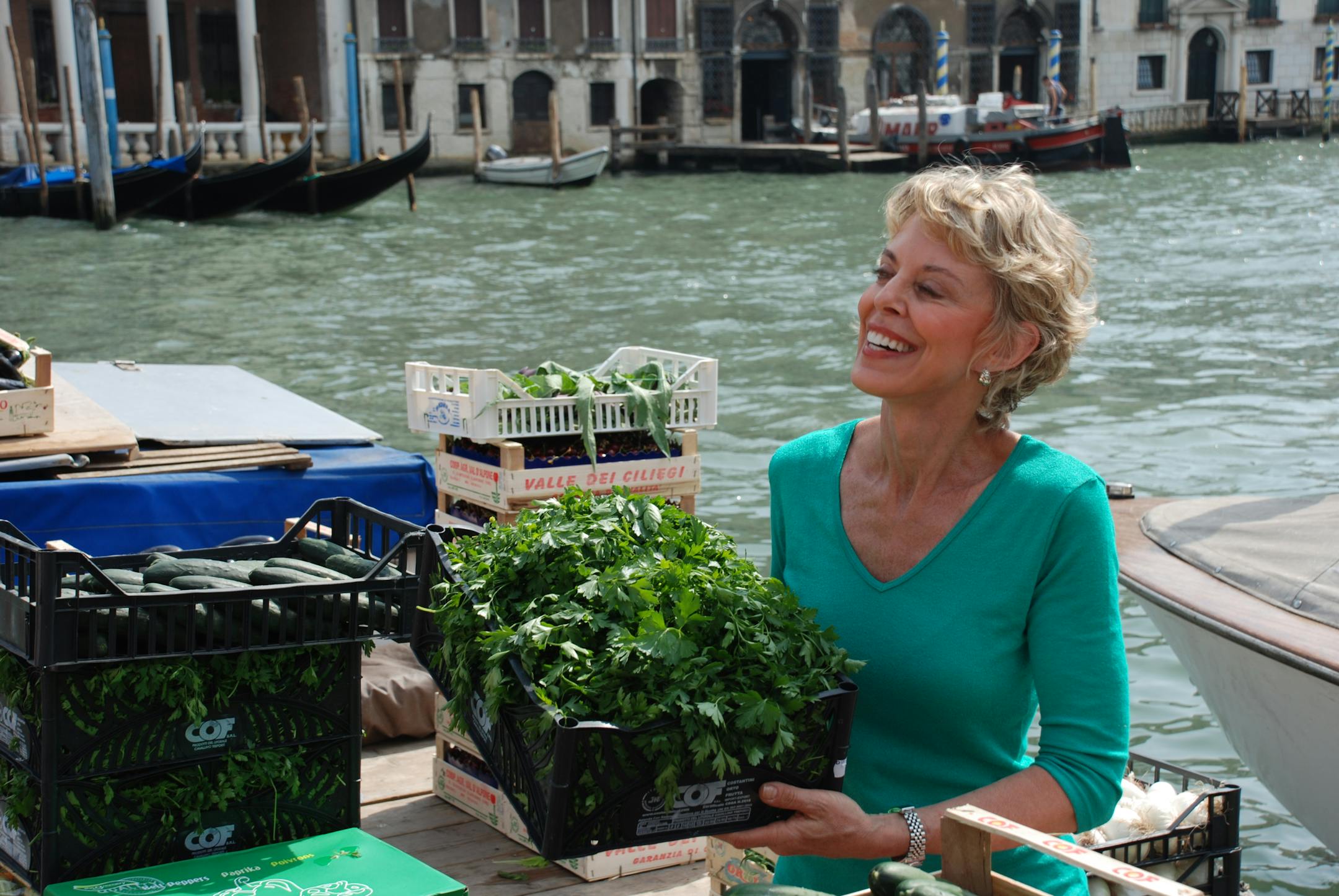 Last May, at the Rialto Market in Venice, a vendor "offered to let me help unload his barge while my son filmed us," said Paulette Mitchell.