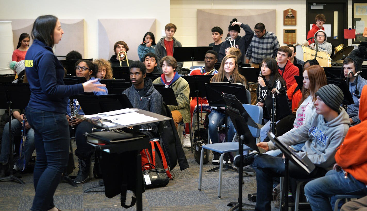 Minneapolis' Edison High School band teacher Lesley Earles (left) is working around the clock to keep music alive in her school where resources are tight and many of her low-income students aren't familiar with music education. In the few years she has been at Edison, she has grown the band class from 15 students to 80 students. She started a drum-line, a jazz band, created a music festival for all northeast schools, and started taking her band students on tour. Earles was recently (Dec. 10) sel