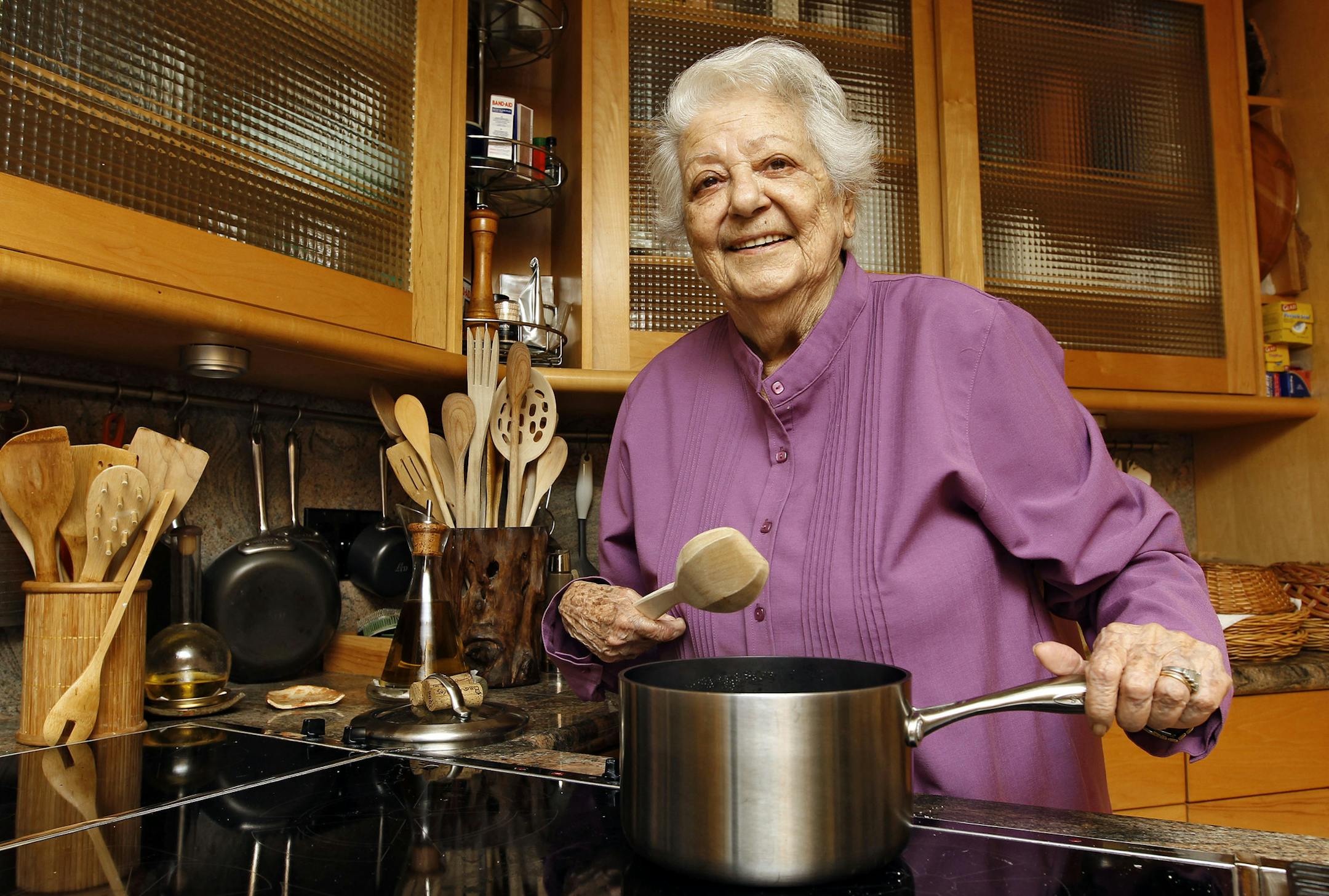 FILE - In this May 29, 2012 file photo, chef Marcella Hazan poses in the kitchen of her Longboat Key, Fla., home. Hazan, the Italian-born cookbook author who taught generations of Americans how to create simple, fresh Italian food, died Sunday, Sept. 30, 2013 at her home in Florida, according to an email from her son, Giuliano Hazan. She was 89. (AP Photo/Chris O'Meara, File)