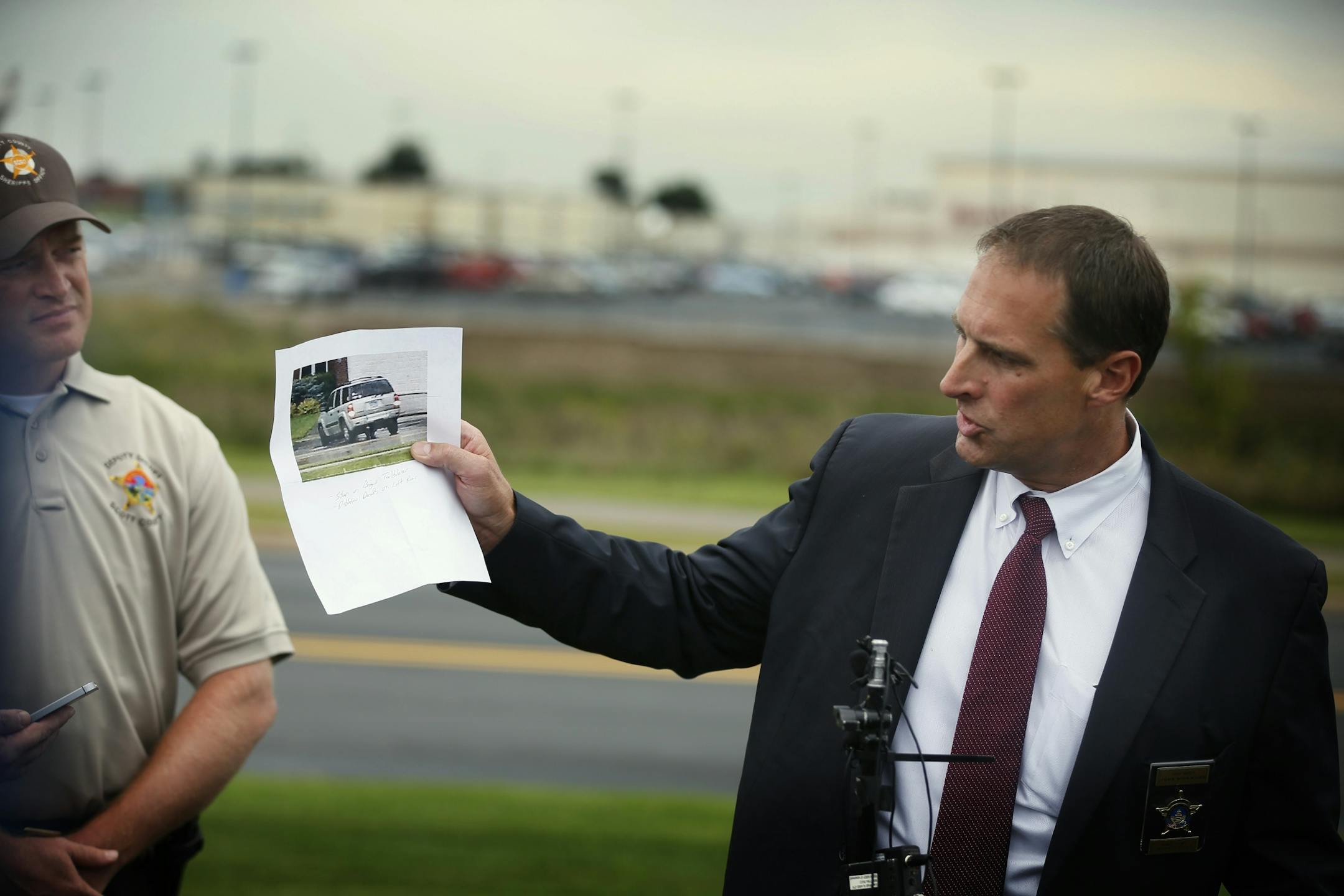 Ramsey County Sheriff chief deputy John Kirkwood held a photograph of a chevy trailblazer. A man who matched the description of murder suspect Ty Hoffman was seen getting in the suv Wednesday September 3 , 2014 in Prior Lake MN .