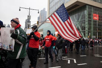 People march to Brooklyn Bridge during an anti-vaccine mandate protest ahead of possible termination of New York City employees due to their vaccinati