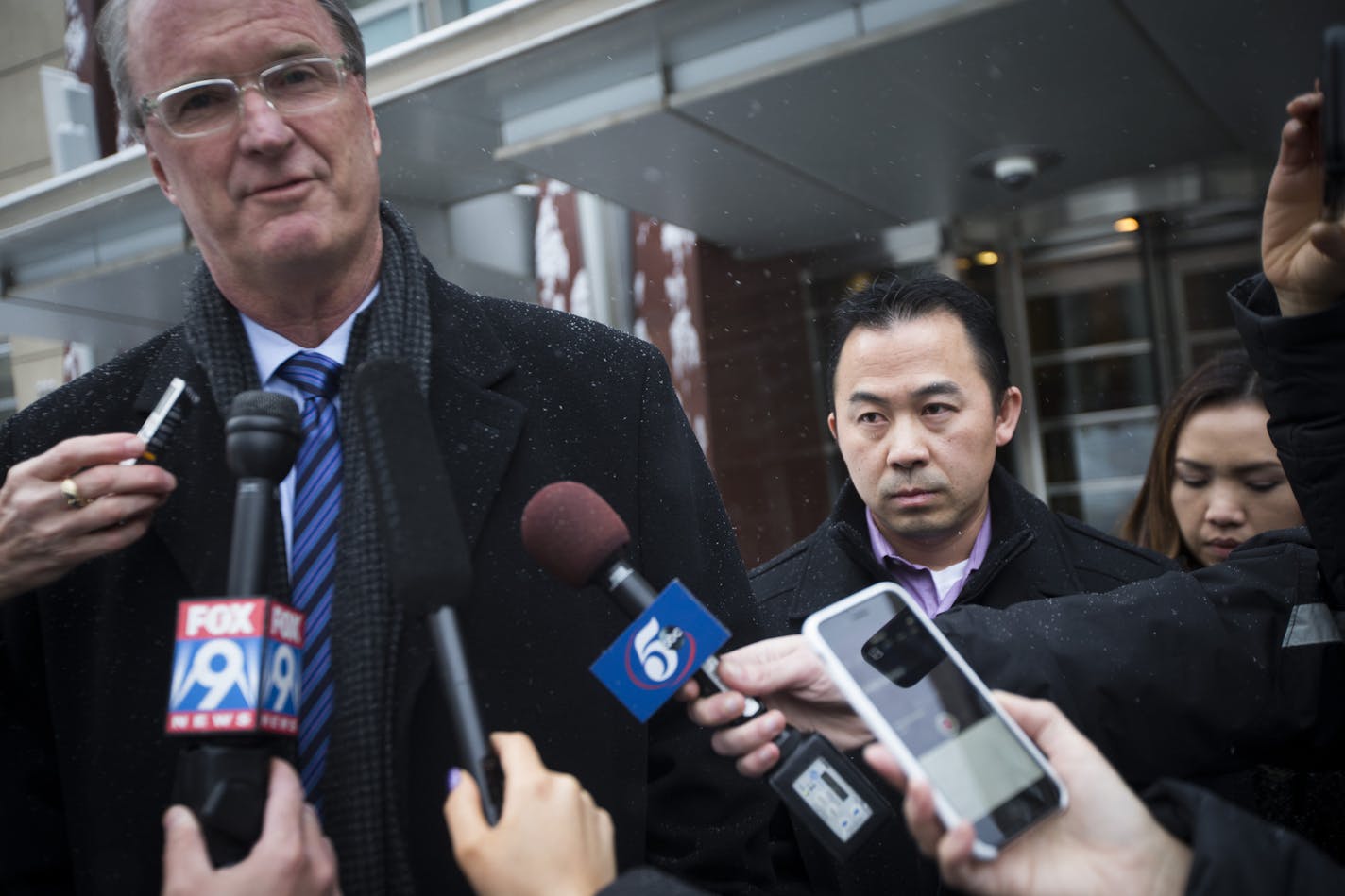 Koua Fong Lee stood with his wife Panghoua Moua, far right, and attorney Bob Hilliard, at left, after a verdict in the Toyota liability trial that found the automaker 60 percent responsible and Lee 40 percent responsible for a 2006 crash that caused the deaths of three people and sent a St. Paul man to prison for more than two years, outside the Federal Courthouse in downtown Minneapolis, Minn. on Tuesday, February 3, 2015. ] RENEE JONES SCHNEIDER &#x2022; reneejones@startribune.com