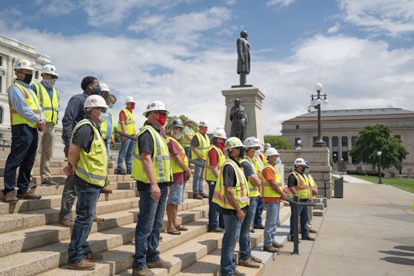 The Minnesota Building and Construction Trades Council holds a press conference on Tuesday, July 21 at the State Capitol's Upper Mall in St. Paul, Min